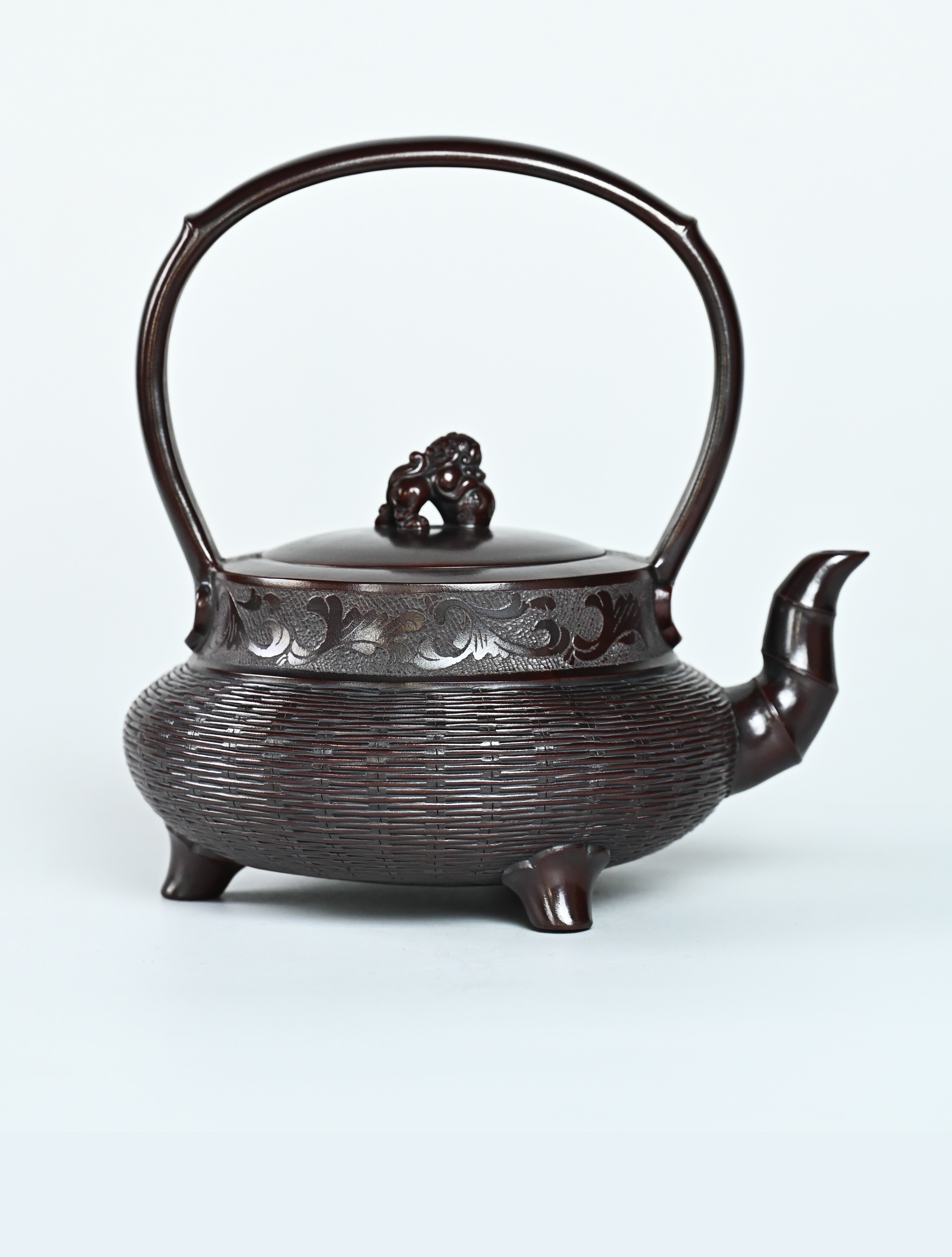 YANYOO handcrafted Yixing teapot featuring aged Wuni clay, bamboo weaving technique and delicate lifting handle, Lifting Tripod, product right side.