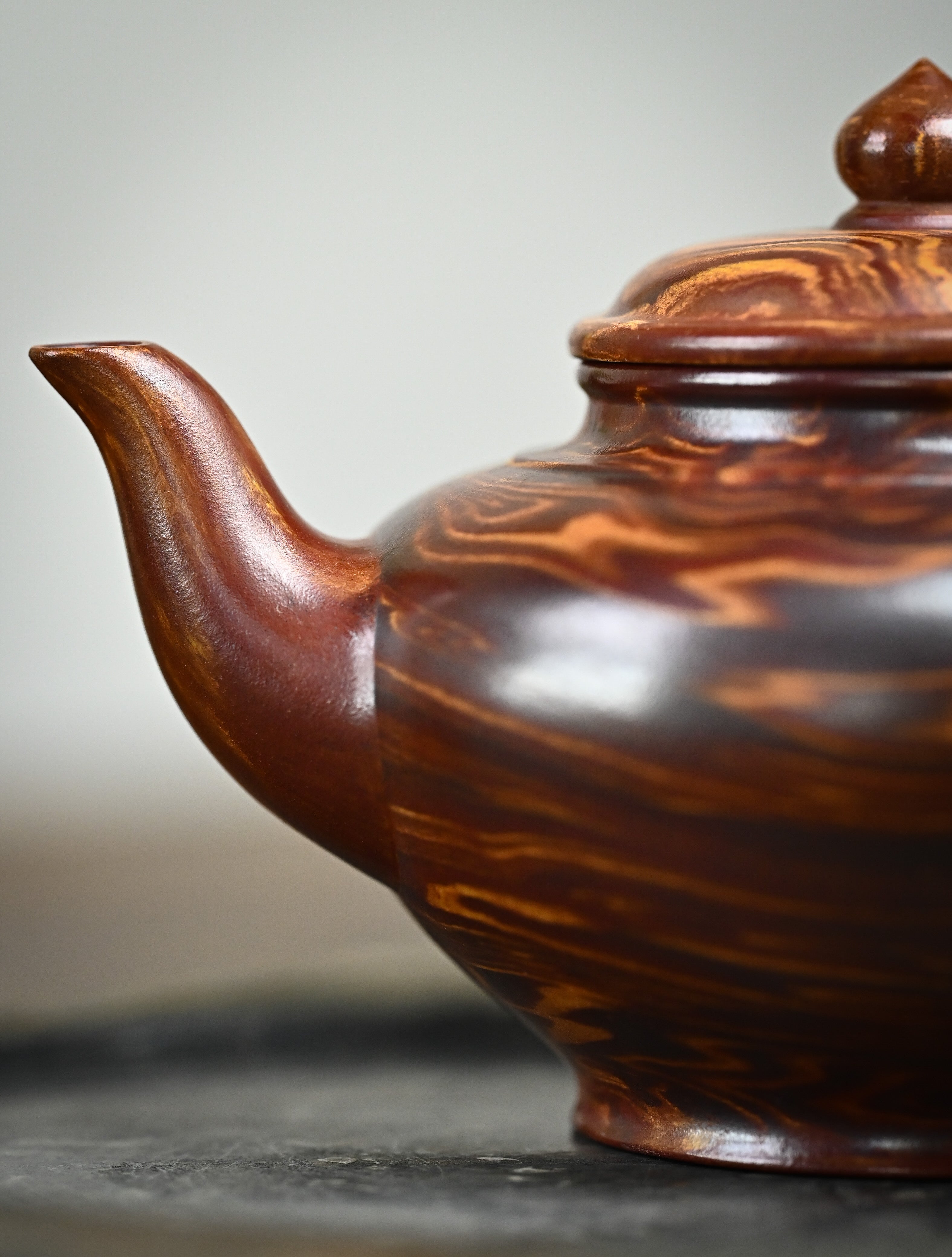 YANYOO handmade Yixing teapot featuring signature Wuni clay and Zisha clay blending technique, Xiao Ying, lifestyle detail front side.