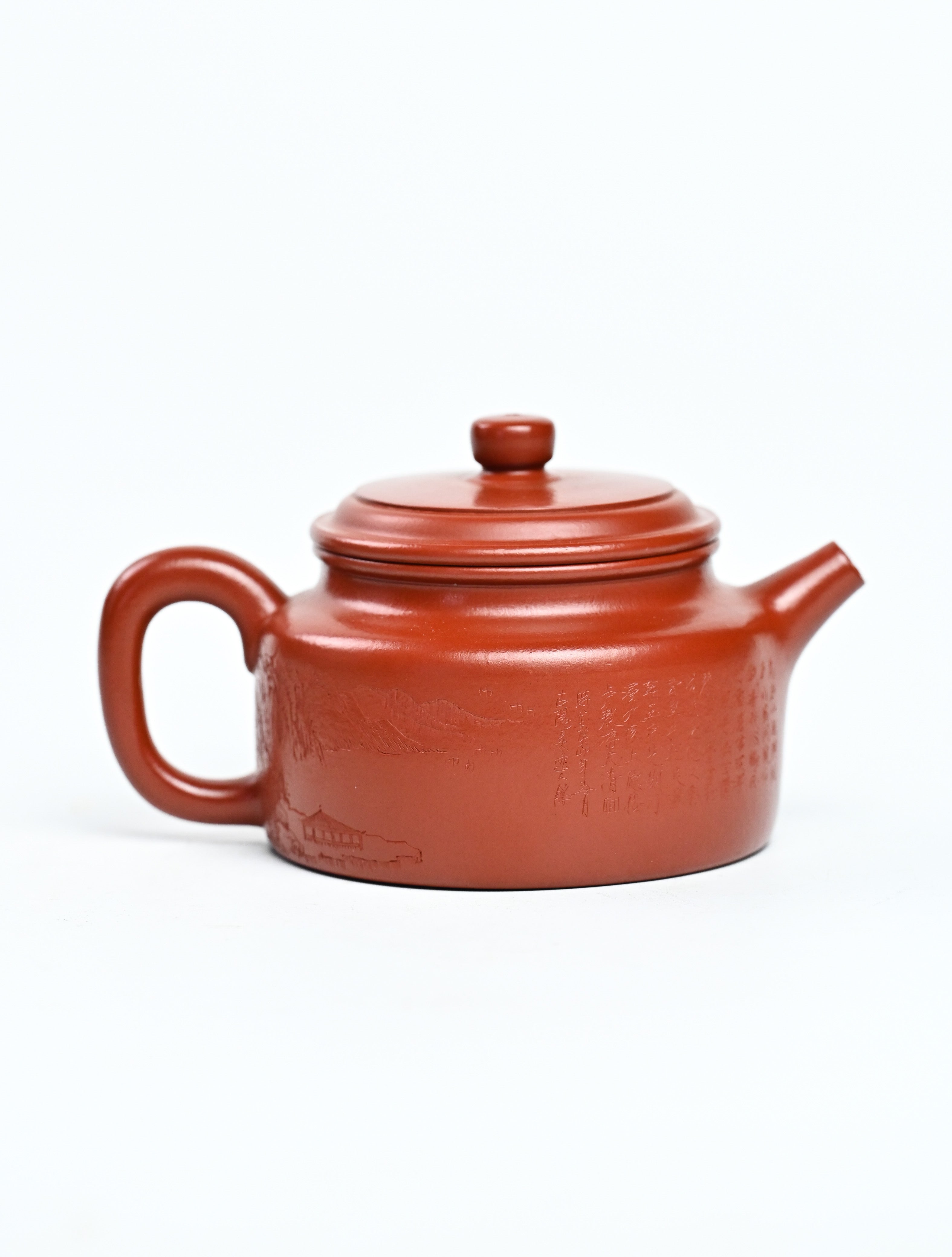 YANYOO handmade Yixing teapot featuring Zhuni clay and Chinese landscape engraving, product right side.