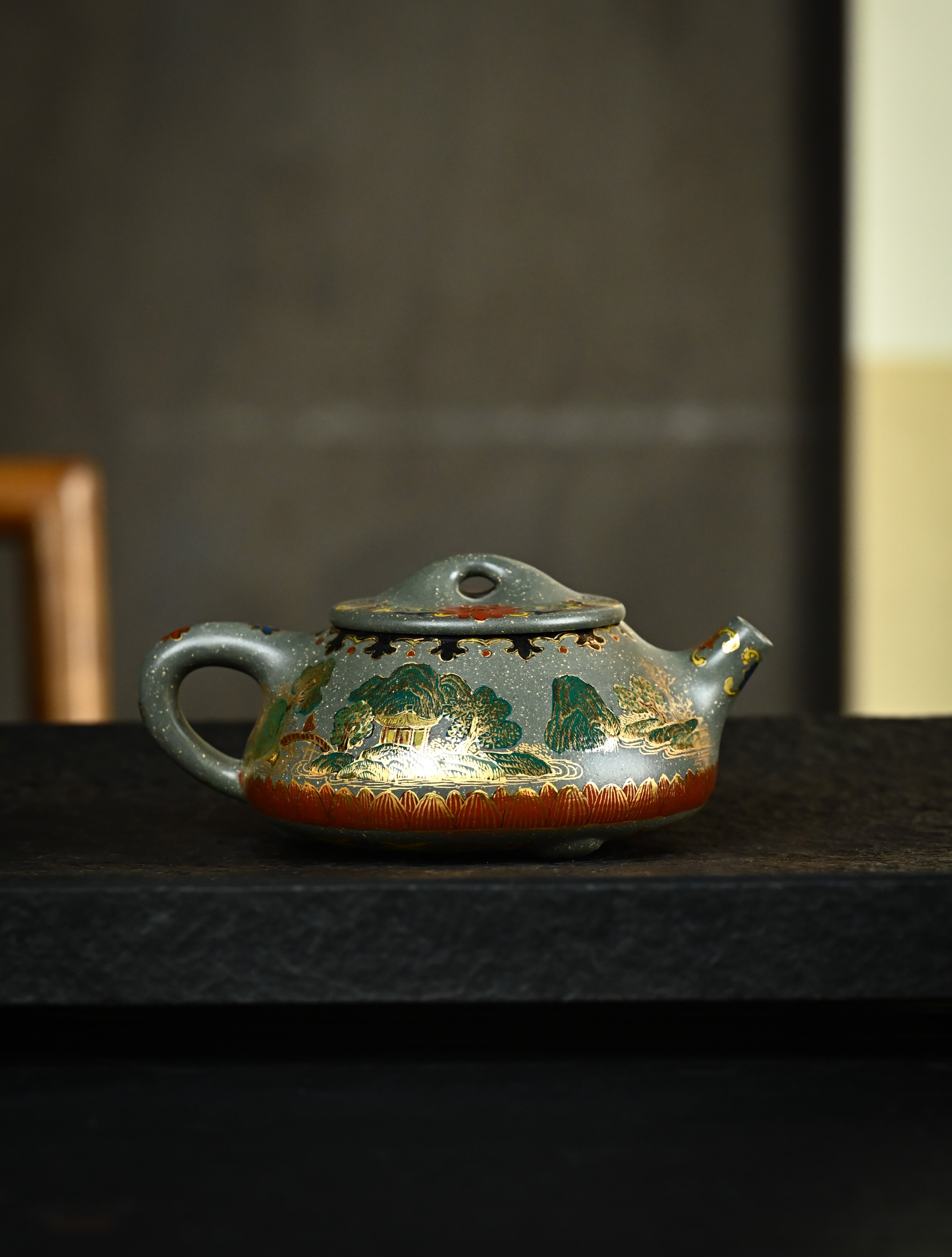 YANYOO handmade Yixing teapot featuring Lvni clay and delicate Falangcai enamel, Jingzhou Shi Piao, lifestyle wide-angle right side.