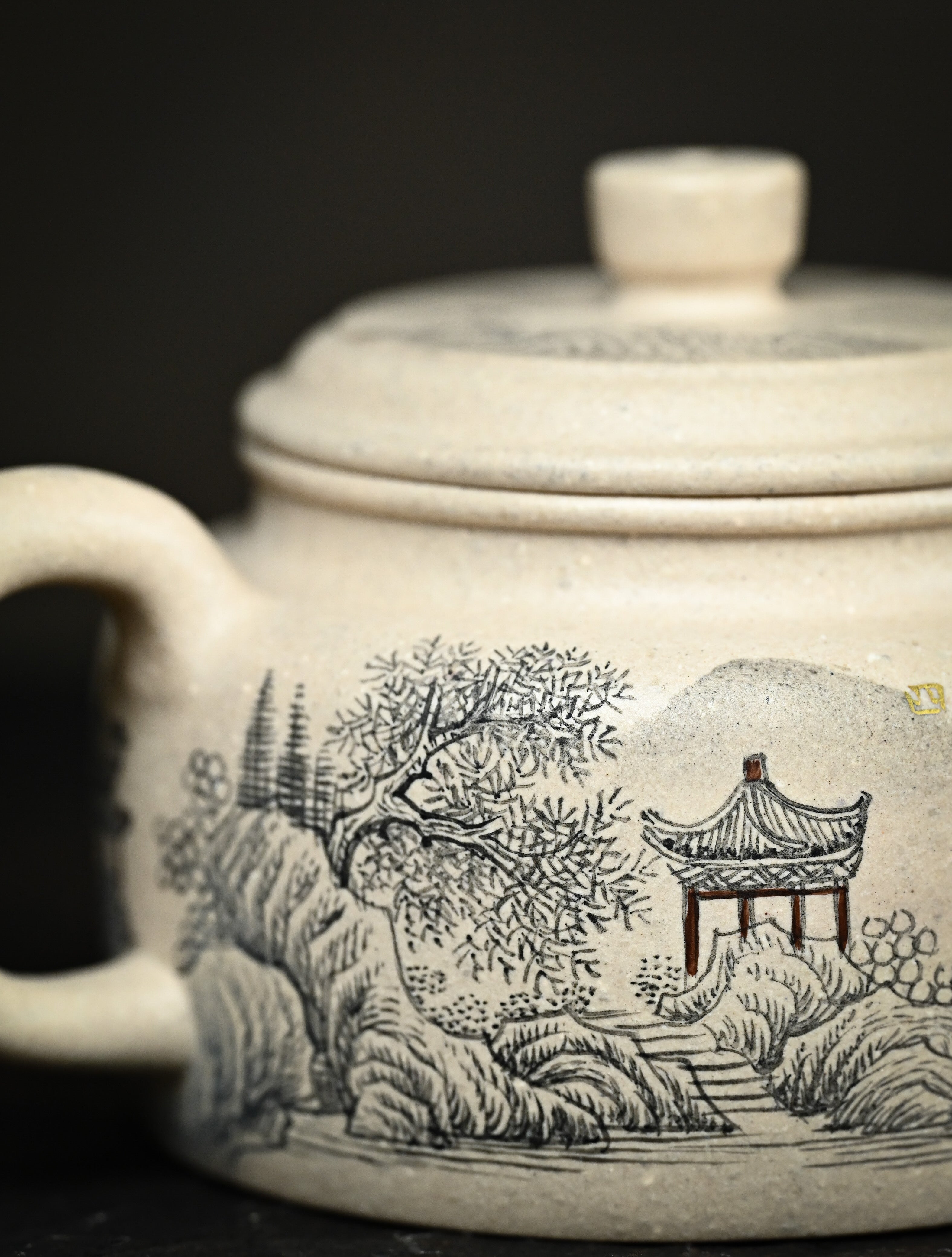 YANYOO handmade Yixing teapot featuring suet white jade Duanni clay and delicate ink painting technique from Jingdezhen China, lifestyle detail.