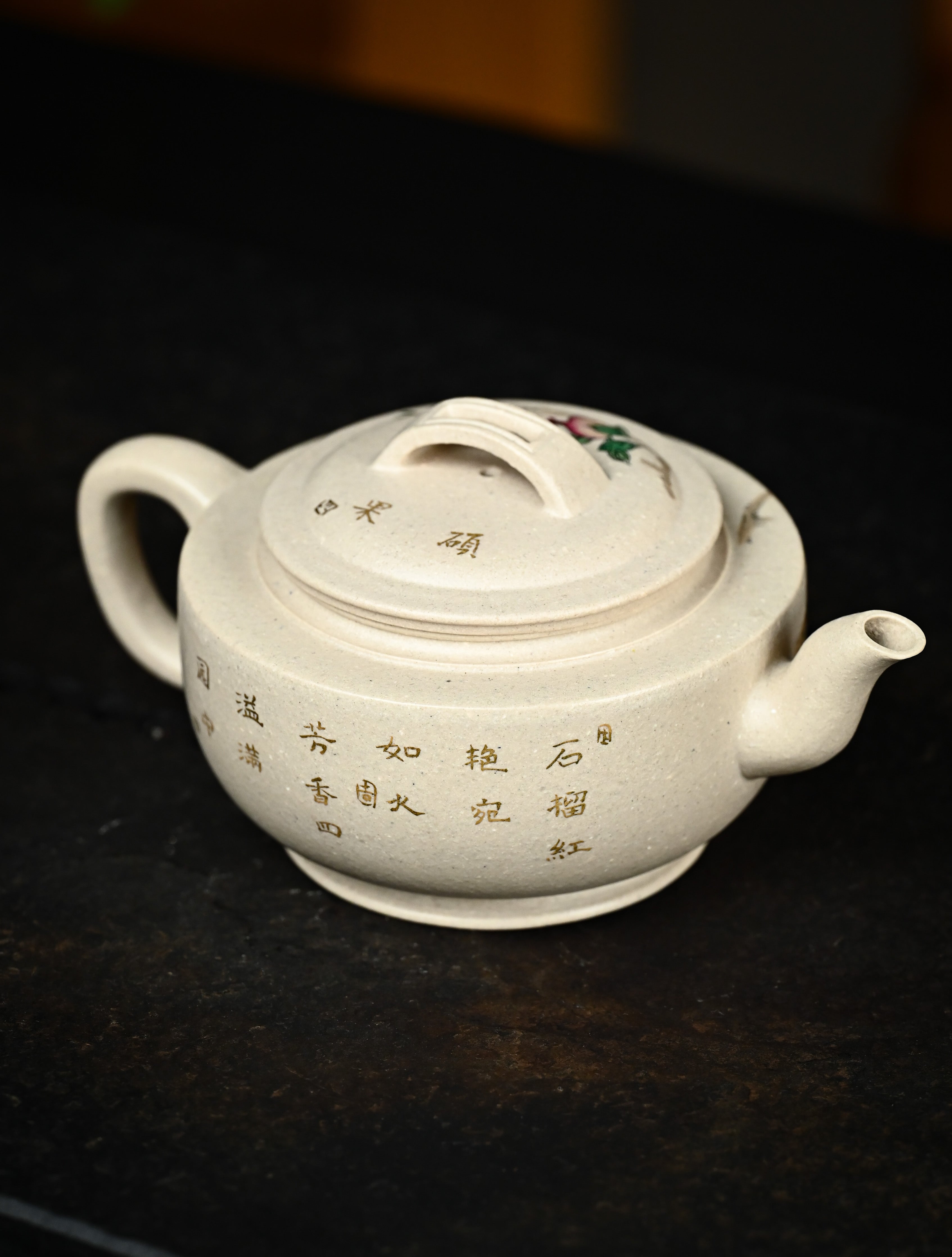 YANYOO handmade Yixing teapot featuring suet white jade Duanni clay and delicate bird-and-pomegranate themed clay painting, Gong Deng, lifestyle right side.