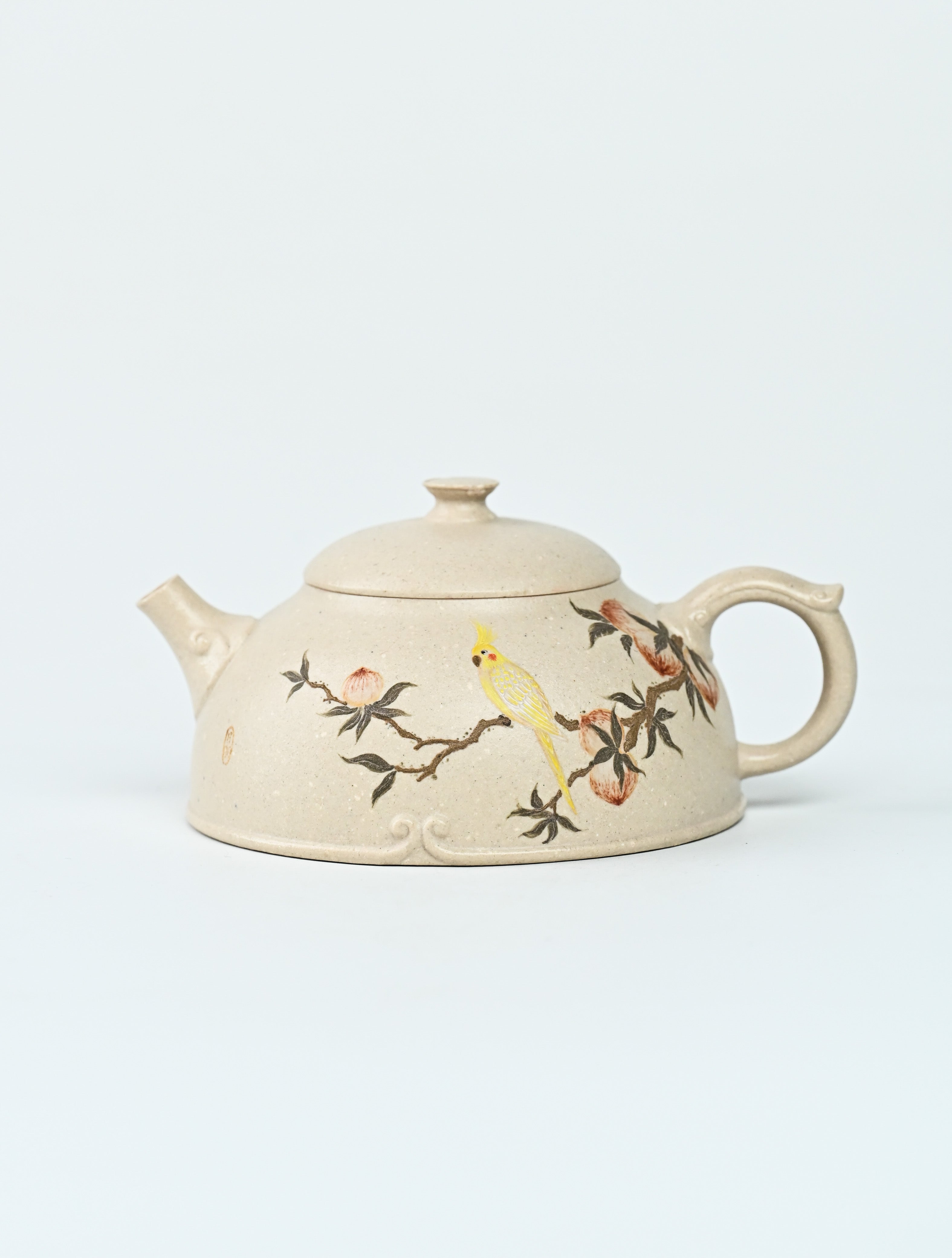 YANYOO handmade Yixing teapot featuring suet white jade Duanni clay and delicate bird-and-peach themed clay painting, product left side.