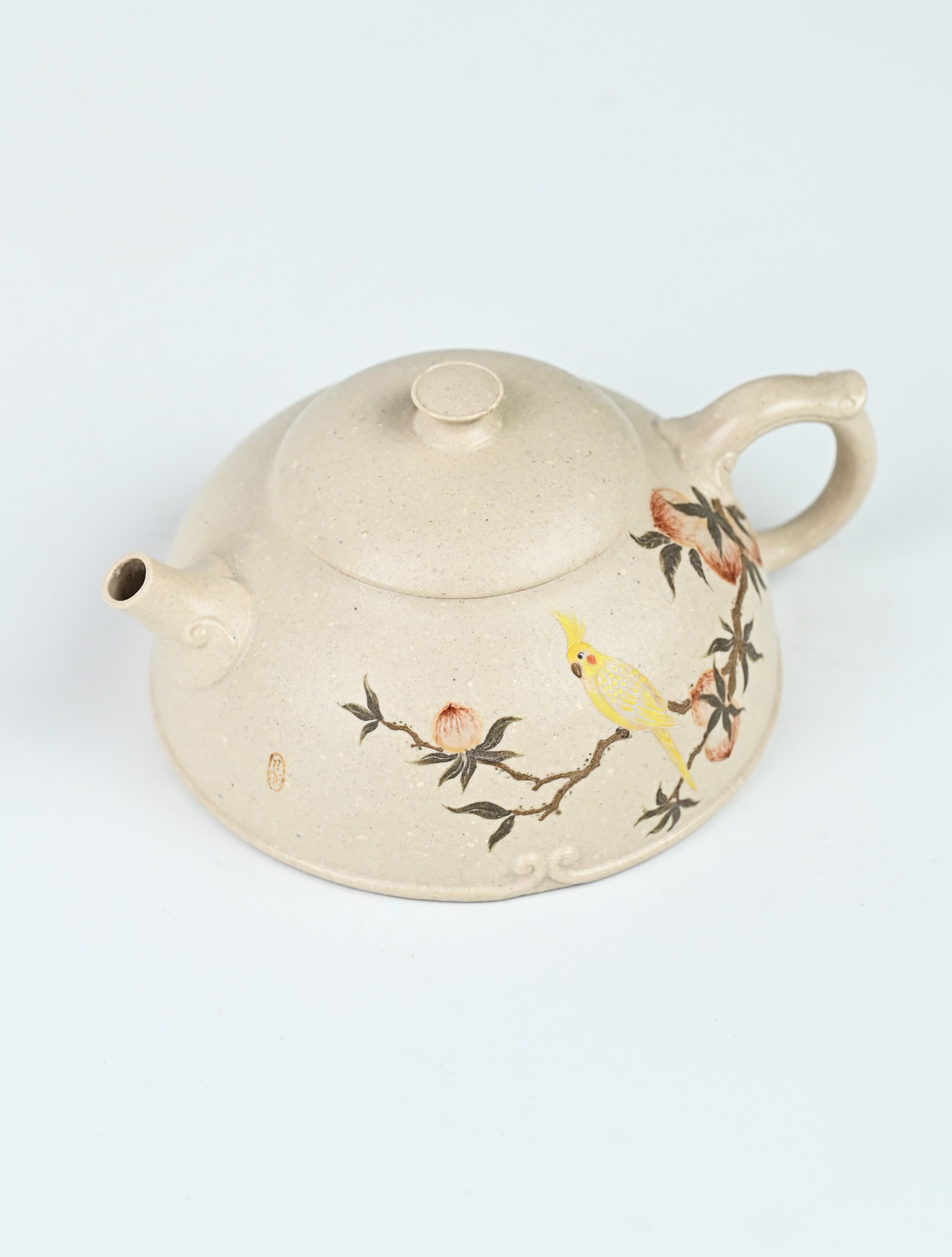 YANYOO handmade Yixing teapot featuring suet white jade Duanni clay and delicate bird-and-peach themed clay painting, product top side.