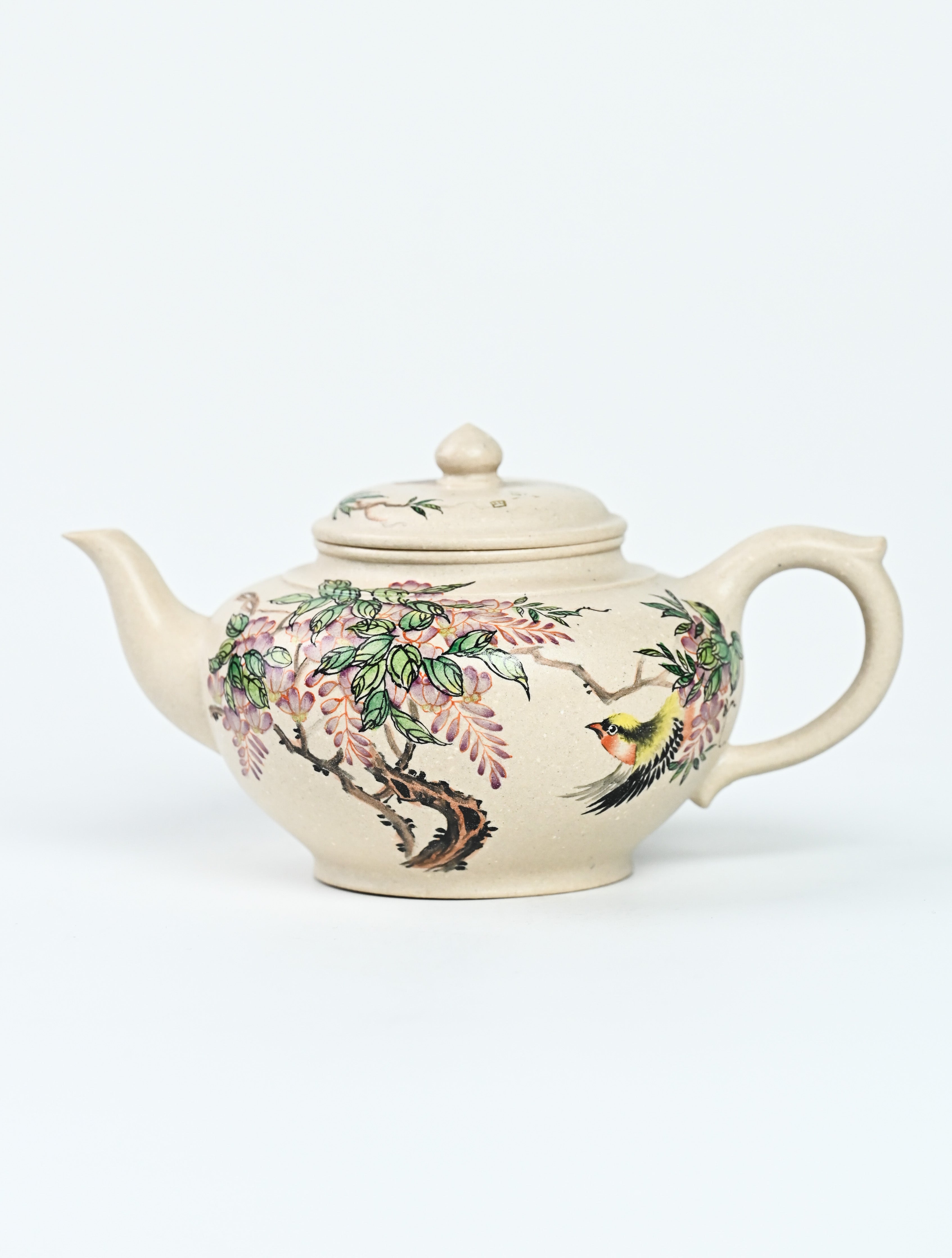 YANYOO handmade Yixing teapot featuring suet white jade Duanni clay and delicate bird-and-peach themed clay painting, Xiao Ying, product left side.