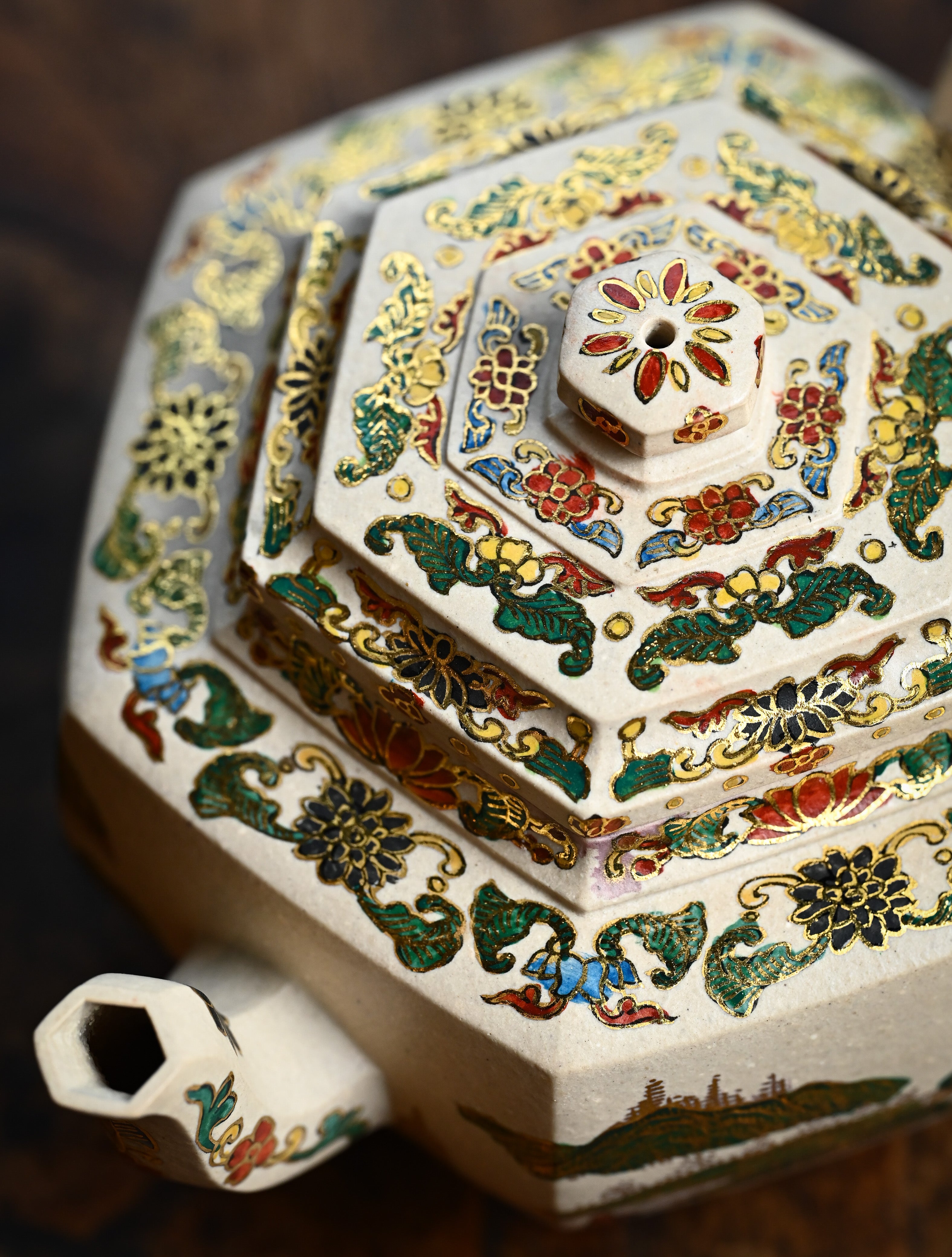 YANYOO handmade Yixing teapot featuring suet white jade Duanni clay and delicate Falangcai, lifestyle detail top side.