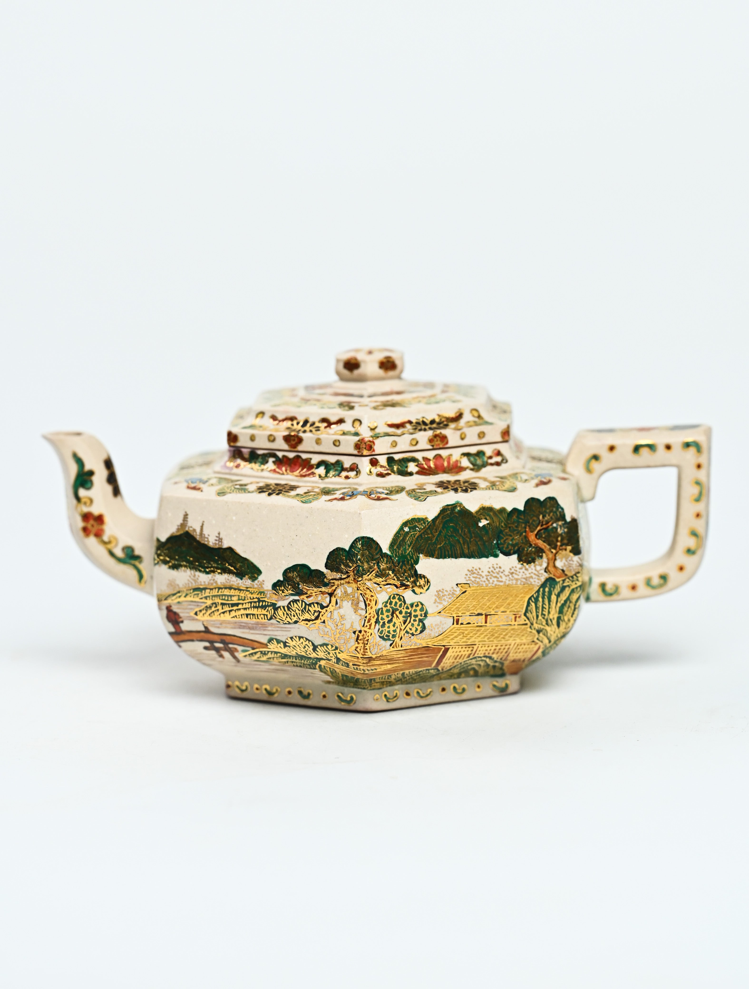 YANYOO handmade Yixing teapot featuring suet white jade Duanni clay and delicate Falangcai, product left side.