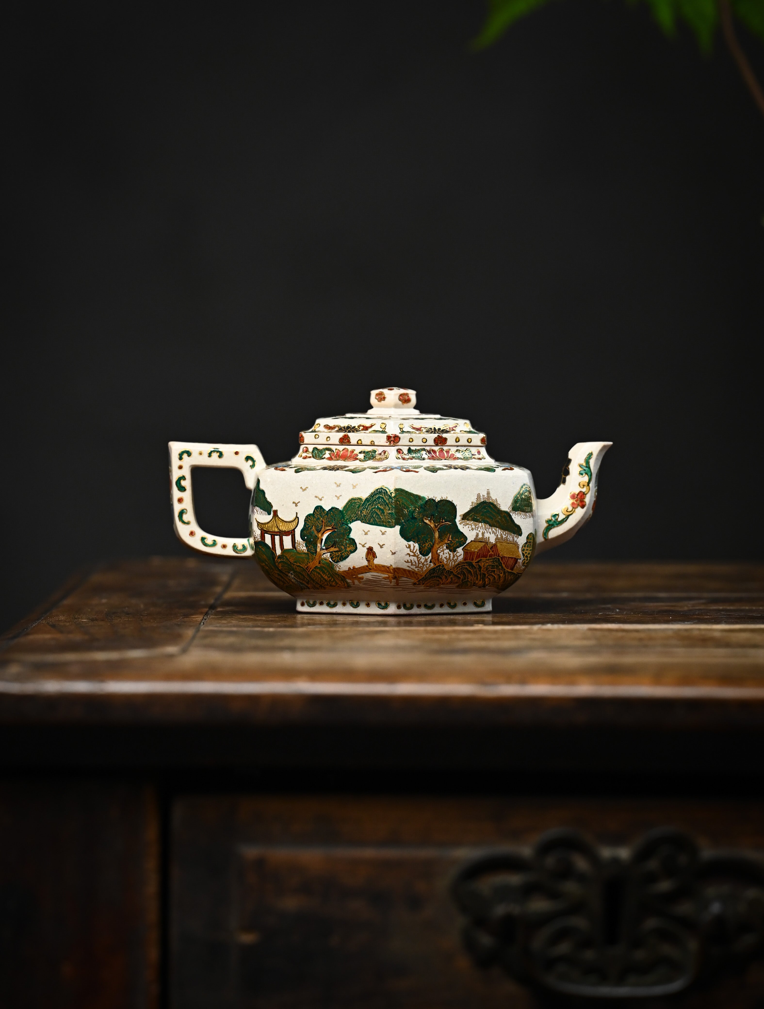 YANYOO handmade Yixing teapot featuring suet white jade Duanni clay and delicate Falangcai, lifestyle wide-angle right side.