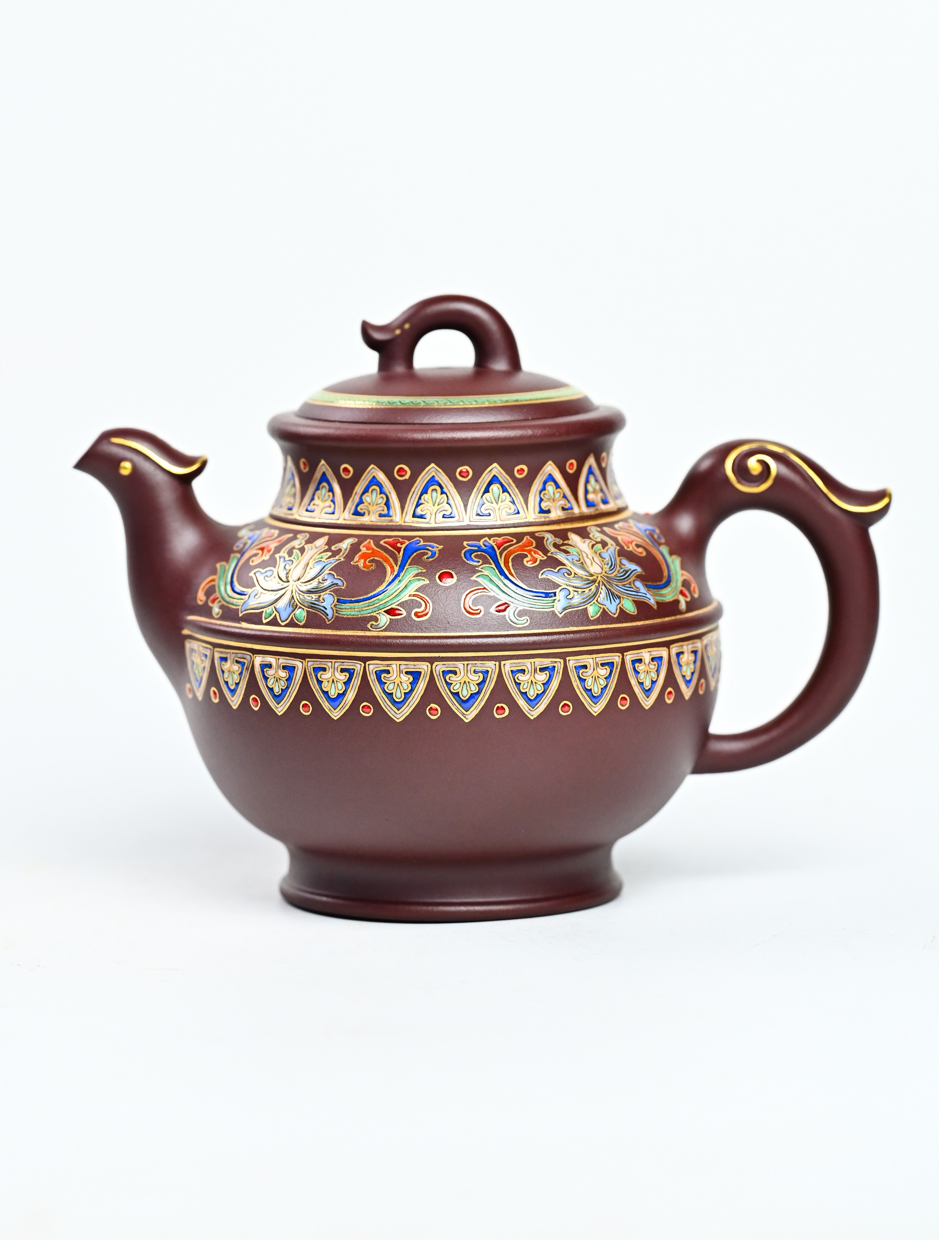 YANYOO handmade Yixing teapot featuring purple clay and lotus-themed Falangcai mimicing a phoenix, product left side.
