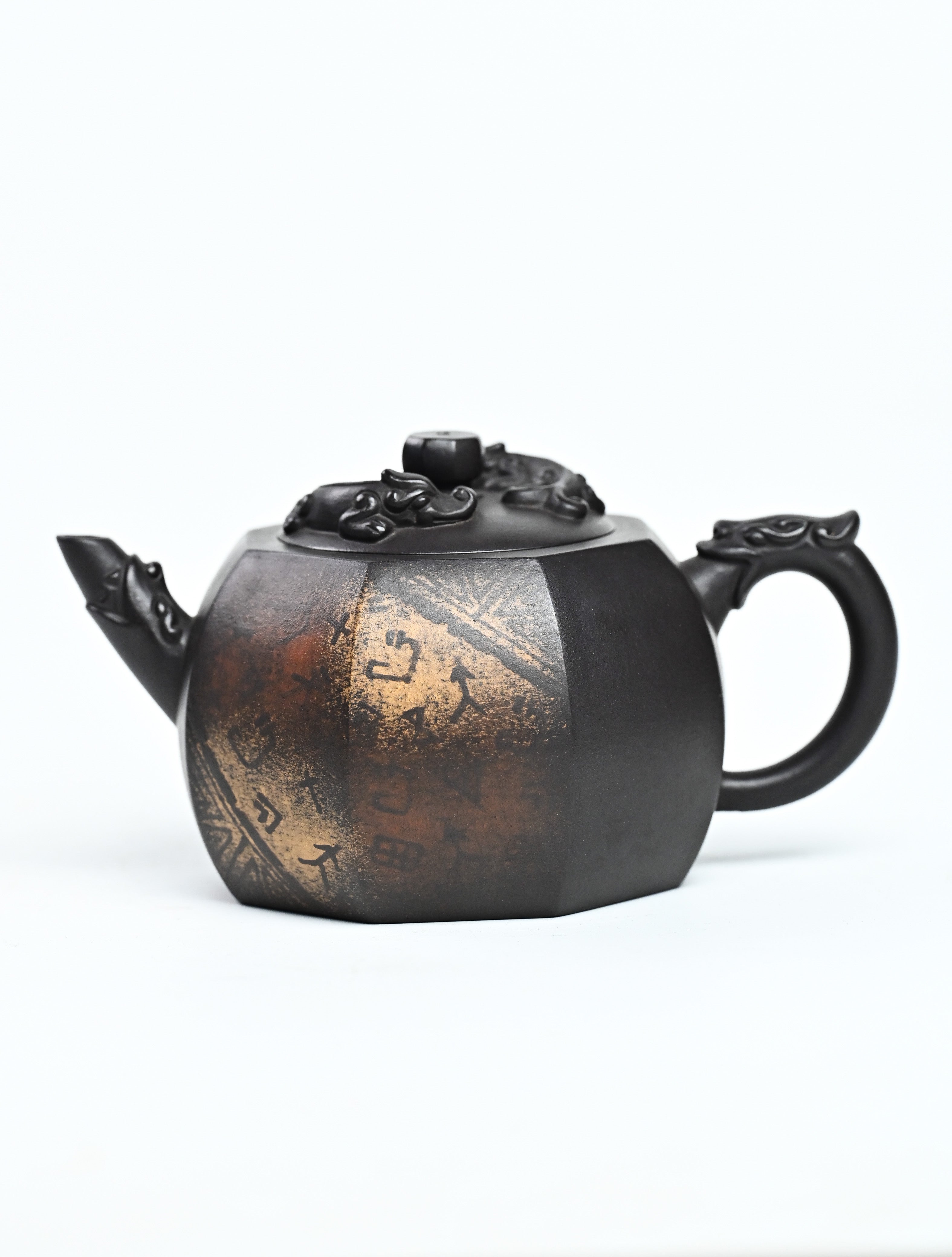 YANYOO handmade Yixing teapot featuring aged Celadon clay, Oracle Bone scripts pattern and the pioneering color decoration method, product left side.