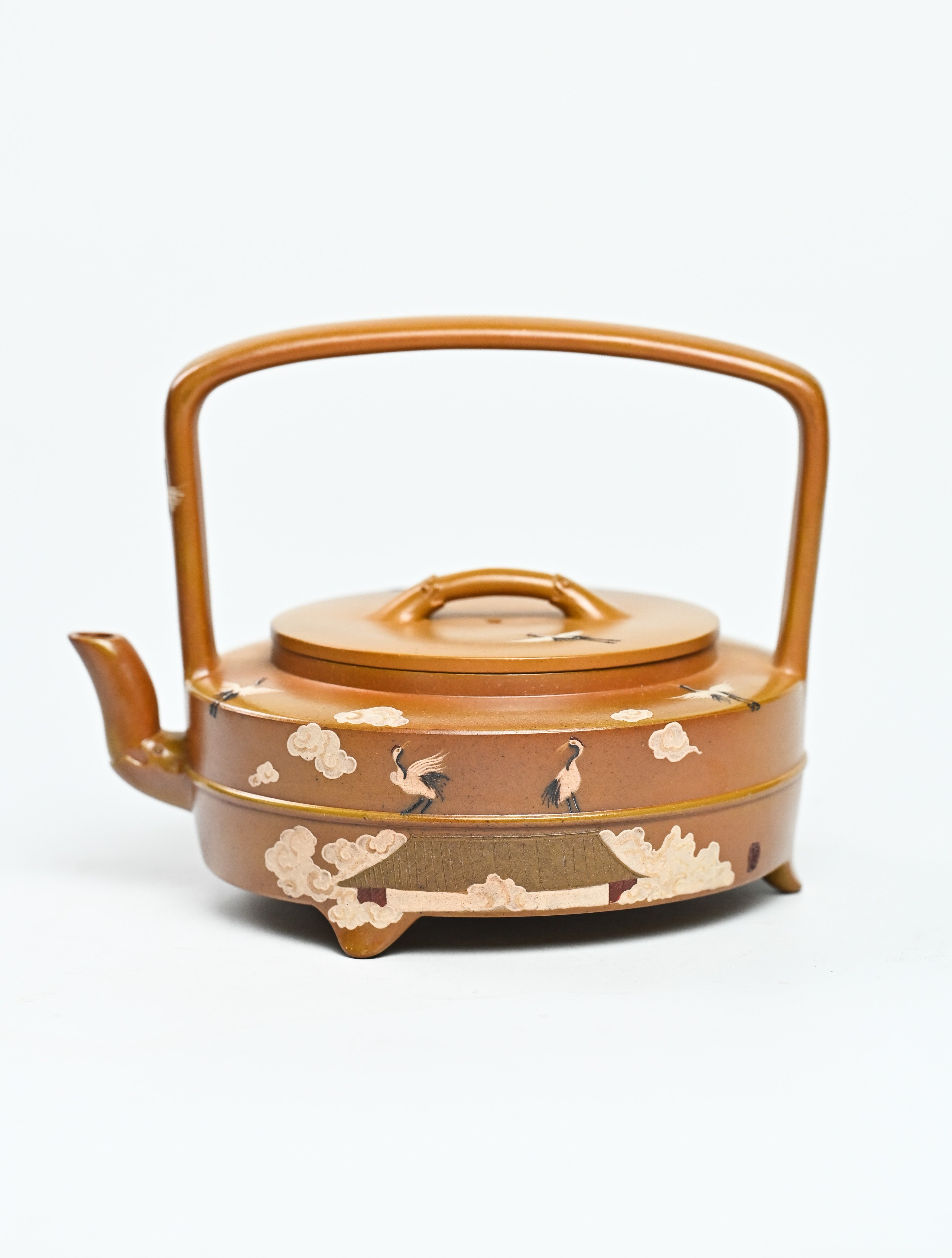 YANYOO handmade wood-fired Yixing teapot featuring hand-painted cloud-and-crane motif and lifting handle, product left side.
