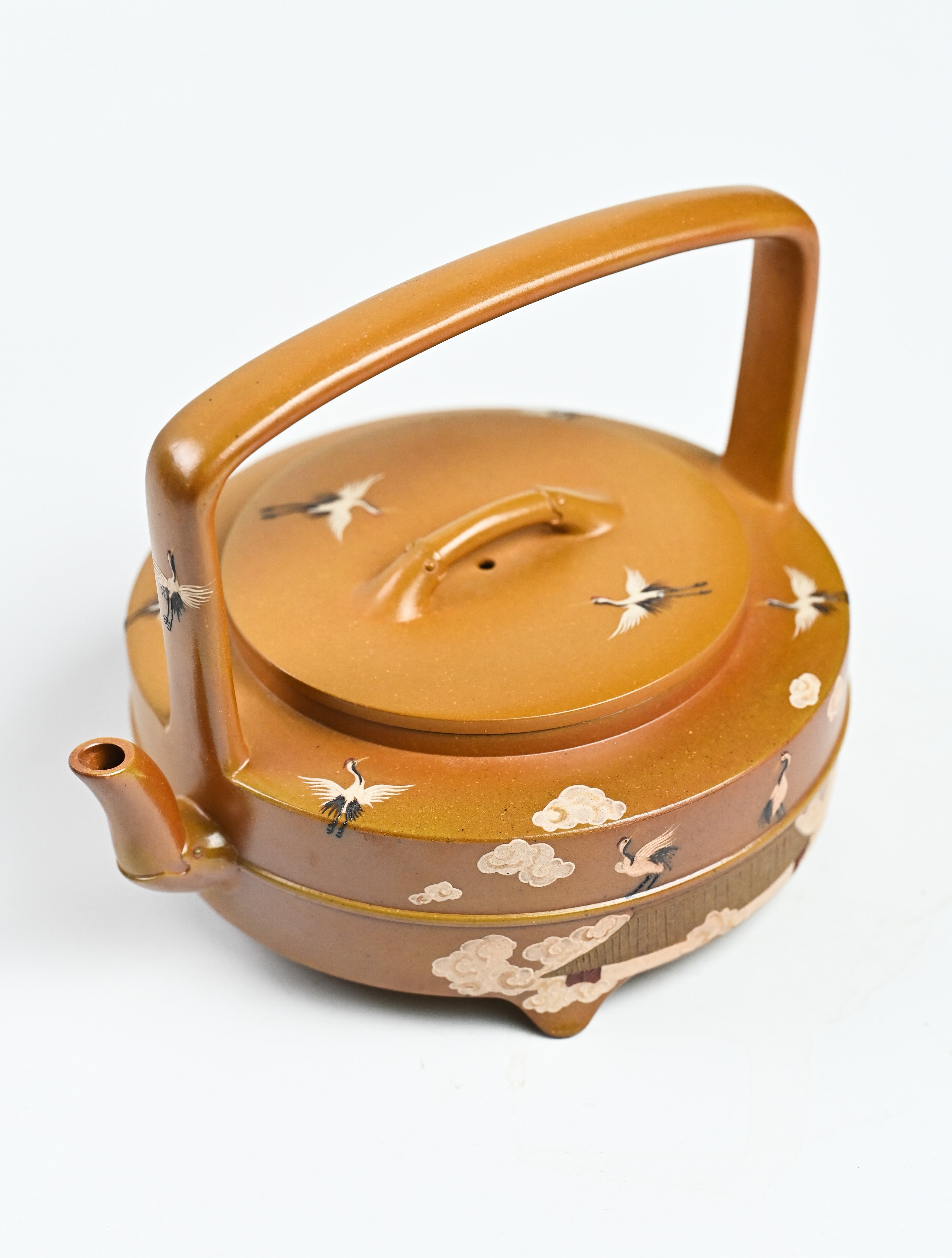 YANYOO handmade wood-fired Yixing teapot featuring hand-painted cloud-and-crane motif and lifting handle, product top side.