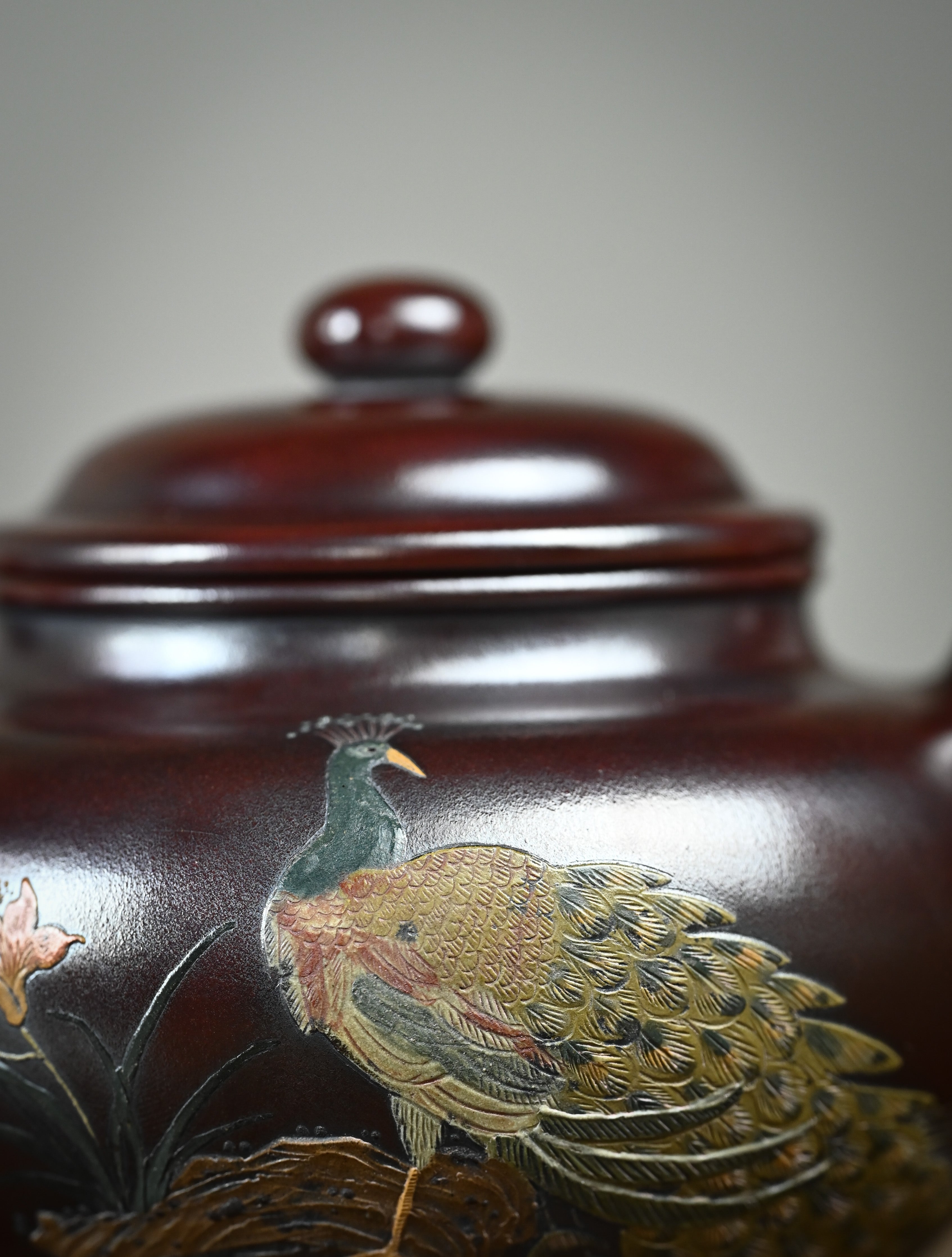 YANYOO handmade Yixing teapot featuring aged Wuni clay, peacock clay painting, Duo Zhi, detail front side.