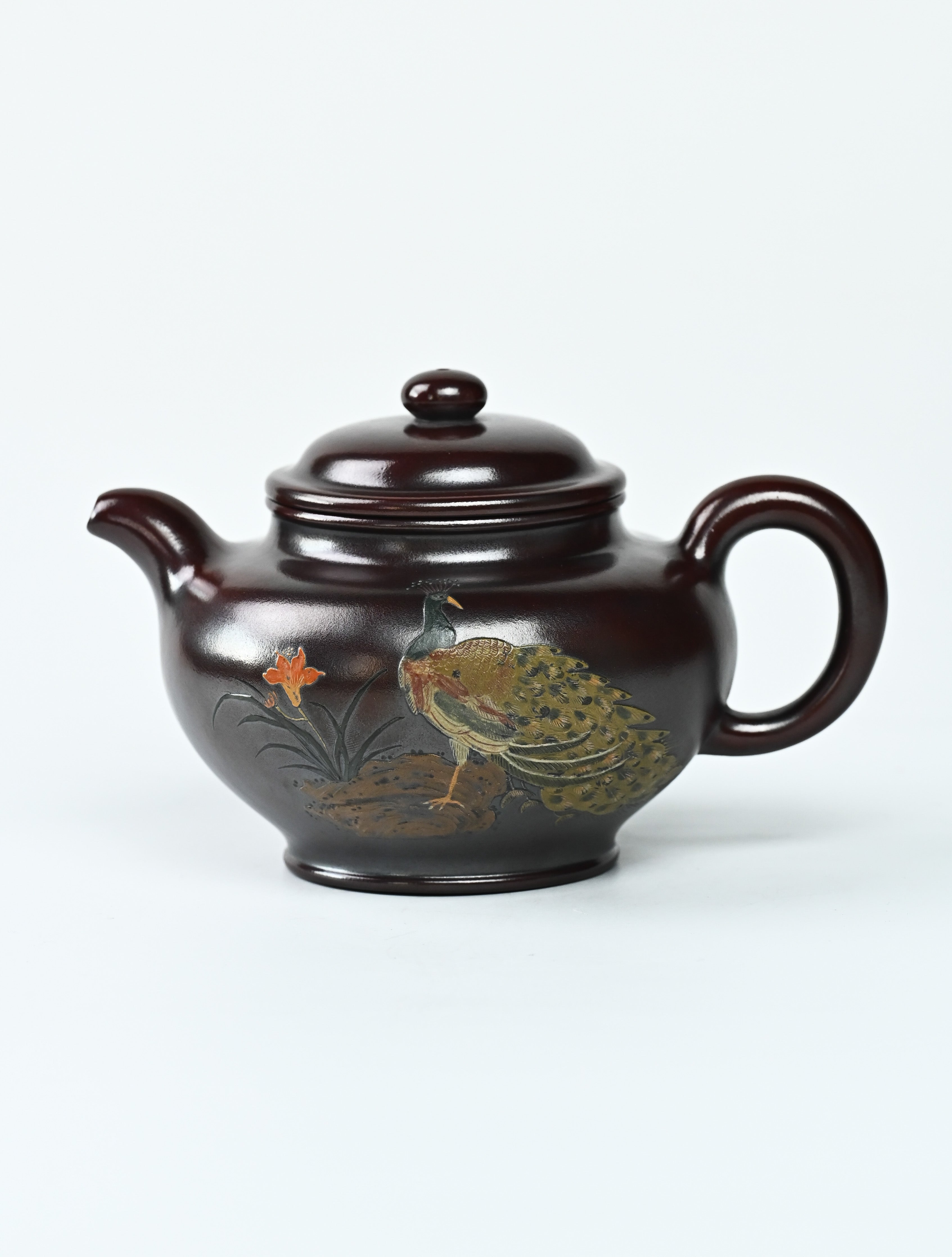 YANYOO handmade Yixing teapot featuring aged Wuni clay, peacock clay painting, Duo Zhi, product left side.