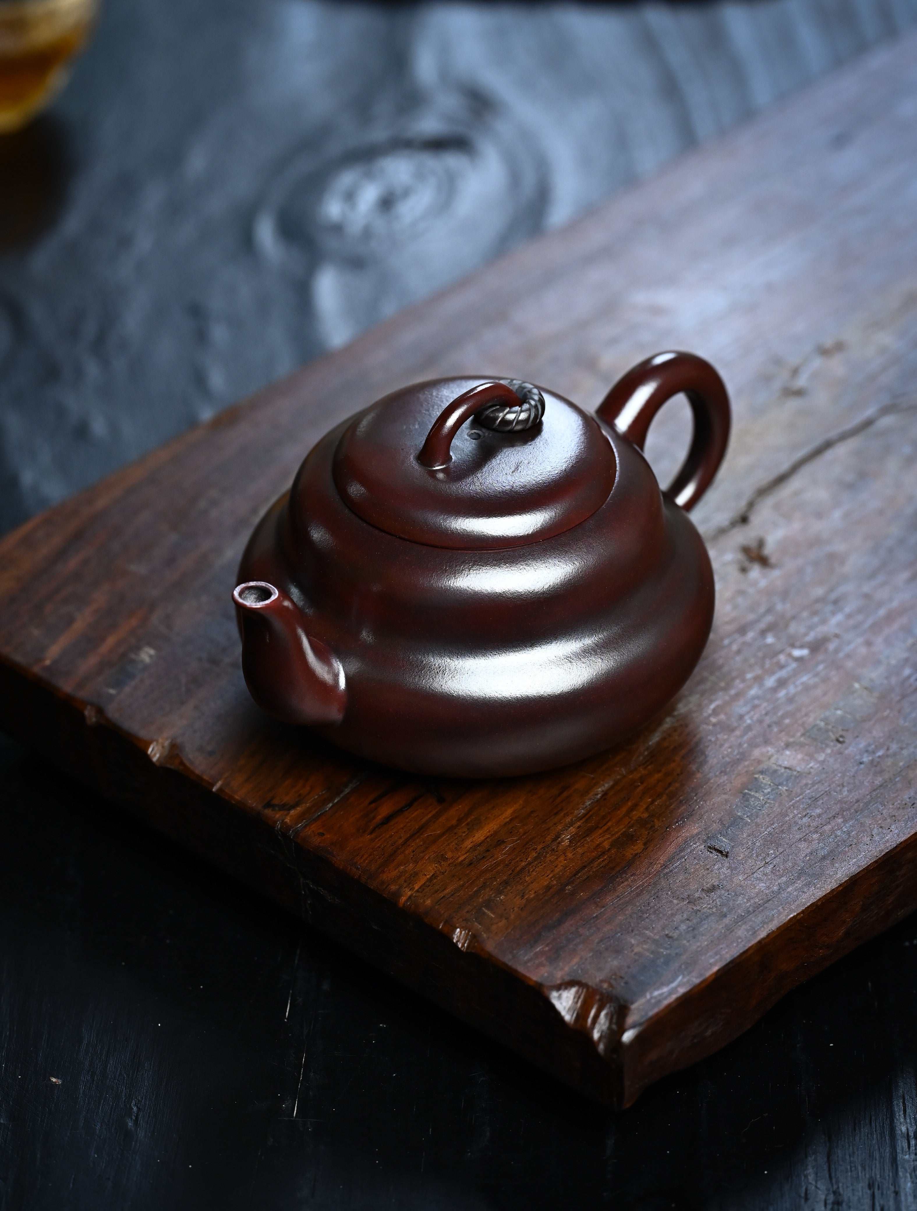 YANYOO handmade Yixing teapot featuring aged Wuni clay and cute gourd shaped, lifestyle left side.