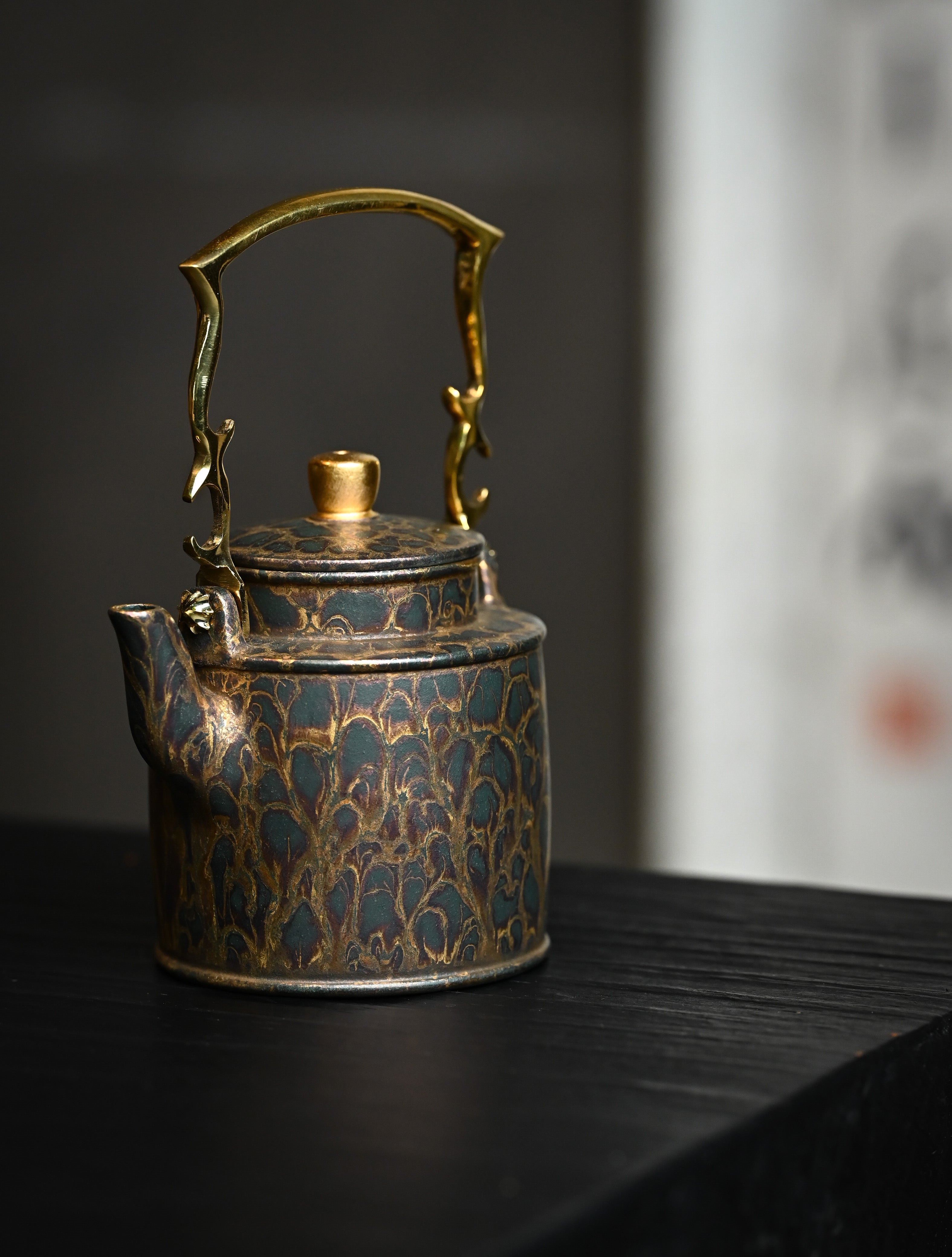 YANYOO handmade Yixing teapot featuring Feather-Plume firing technique, Yang Tong, lifestyle front side.