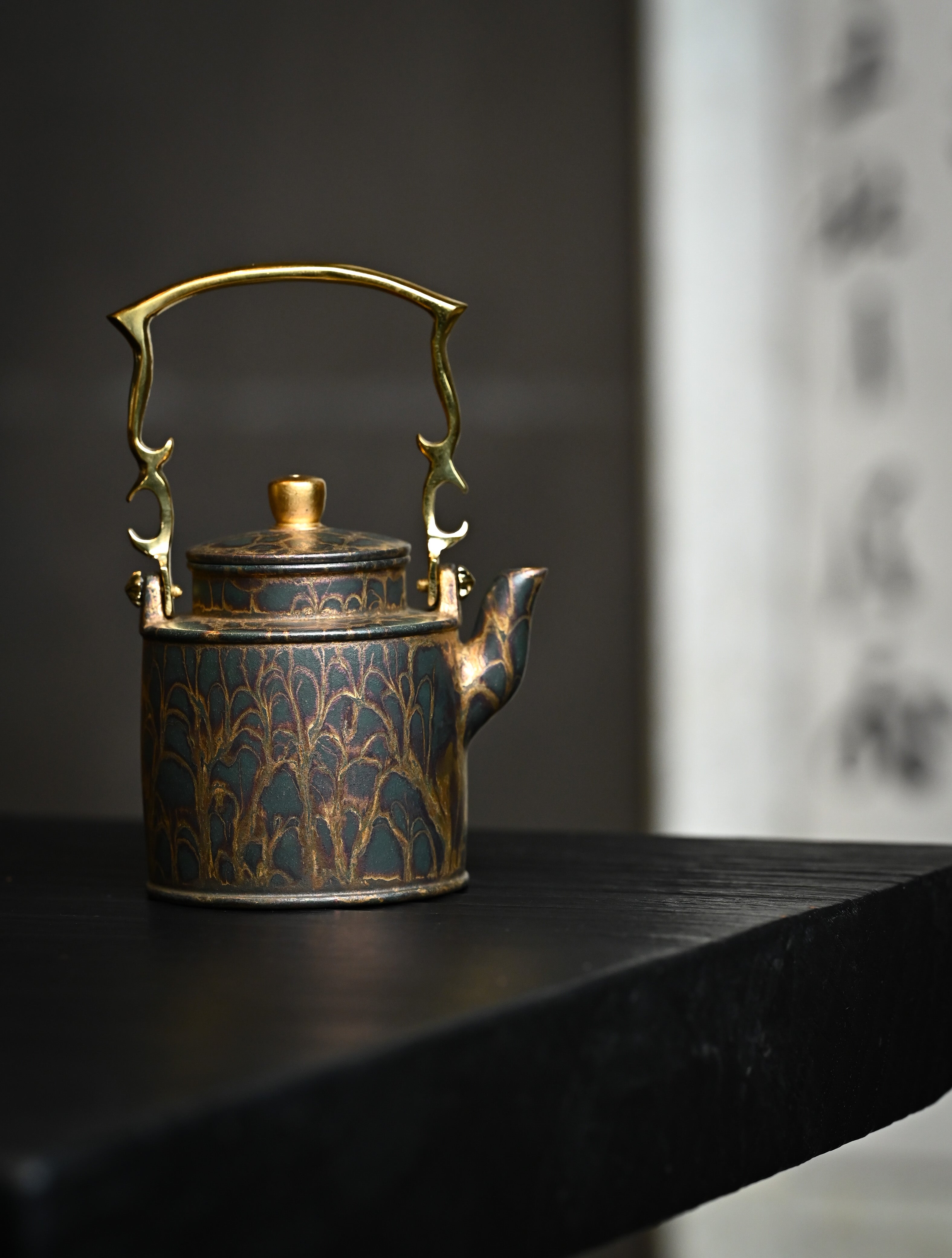YANYOO handmade Yixing teapot featuring Feather-Plume firing technique, Yang Tong, lifestyle wide-angle right side.