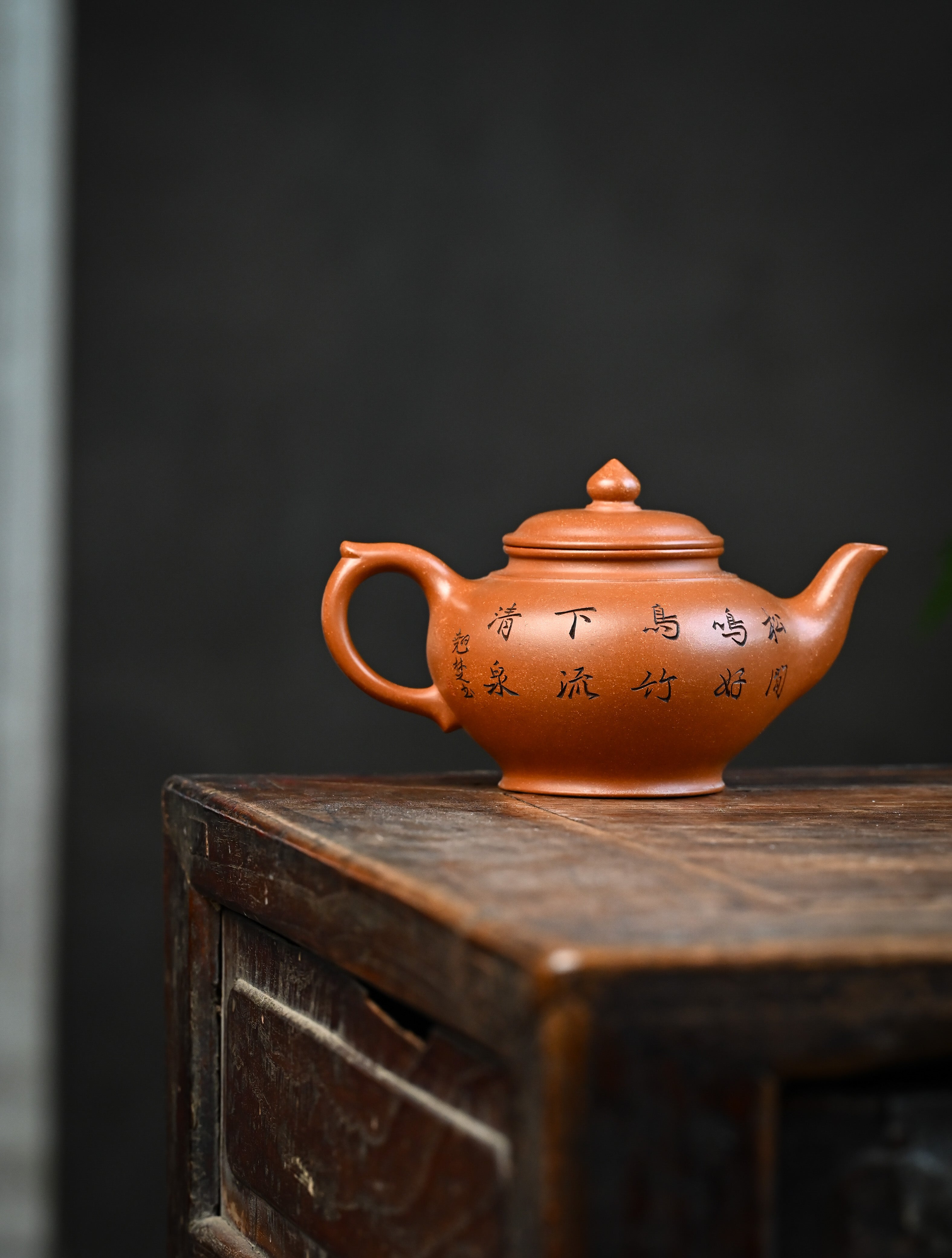 YANYOO handmade Yixing teapot featuring Yucheng Kiln Duanni clay and delicate engravings, Xiao Ying, lifestyle wide-angle right side.