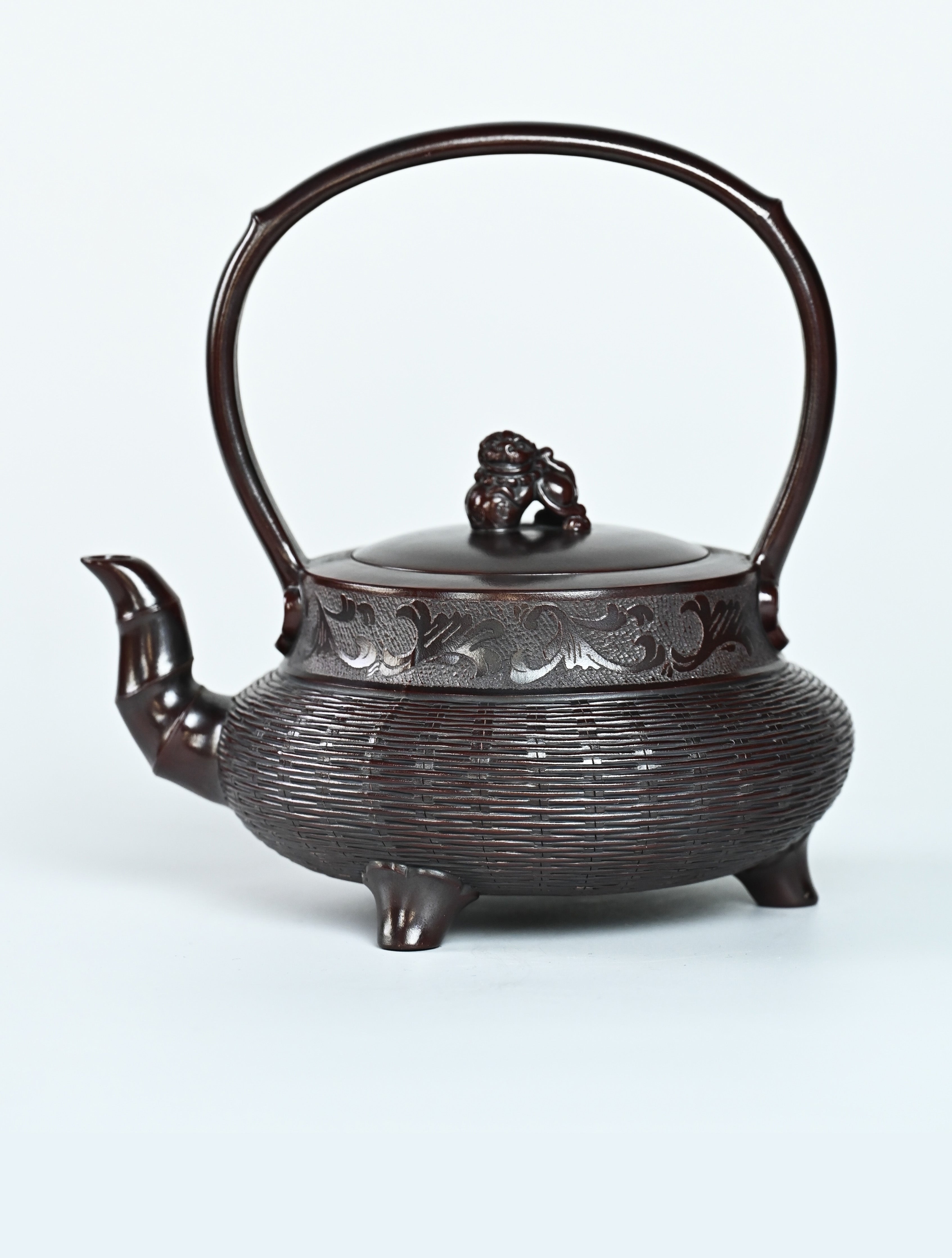 YANYOO handcrafted Yixing teapot featuring aged Wuni clay, bamboo weaving technique and delicate lifting handle, Lifting Tripod, product left side.