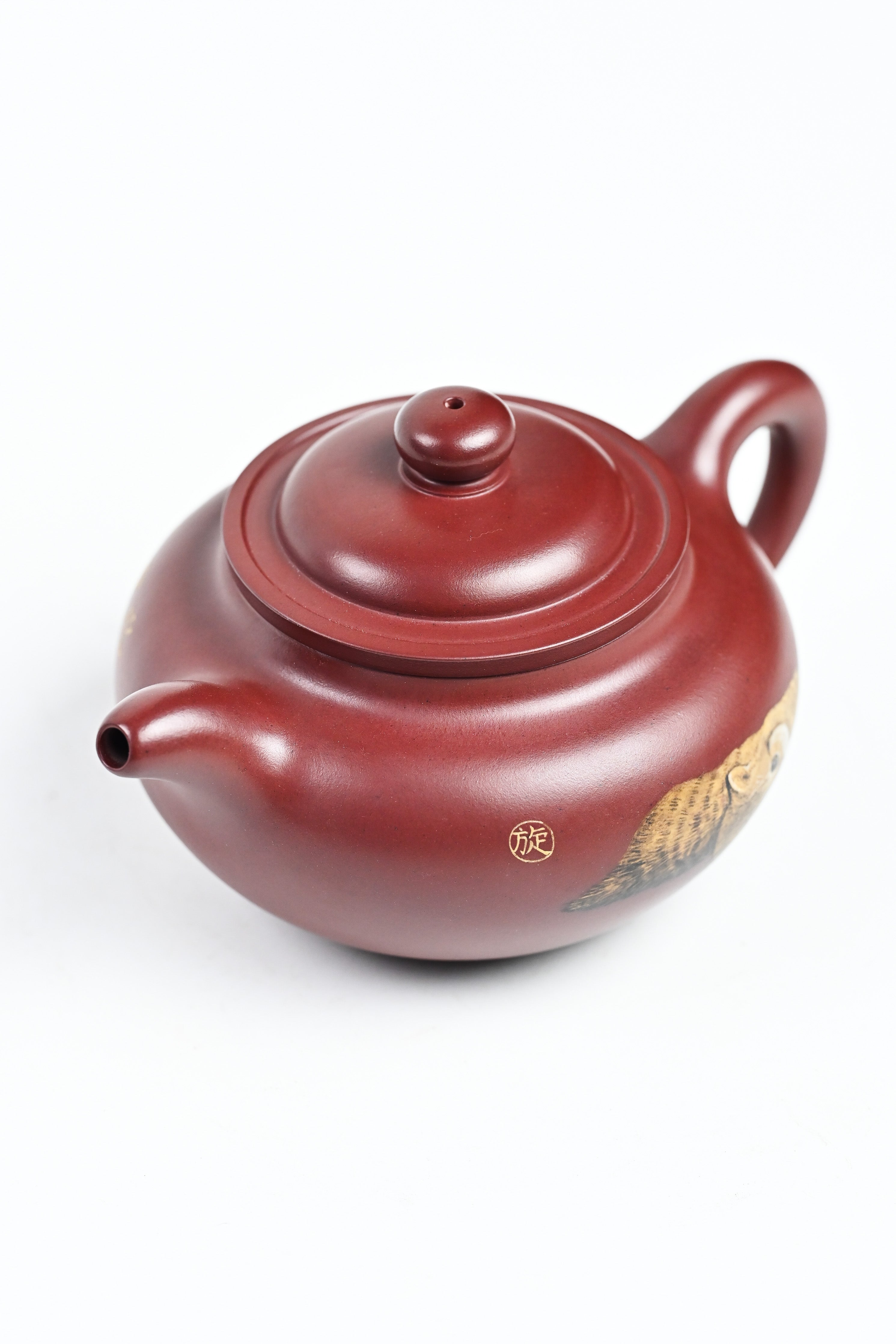 Handmade YANYOO Yixing teapot featuring Hong Pi Long clay and embedded clay painting, product top side.