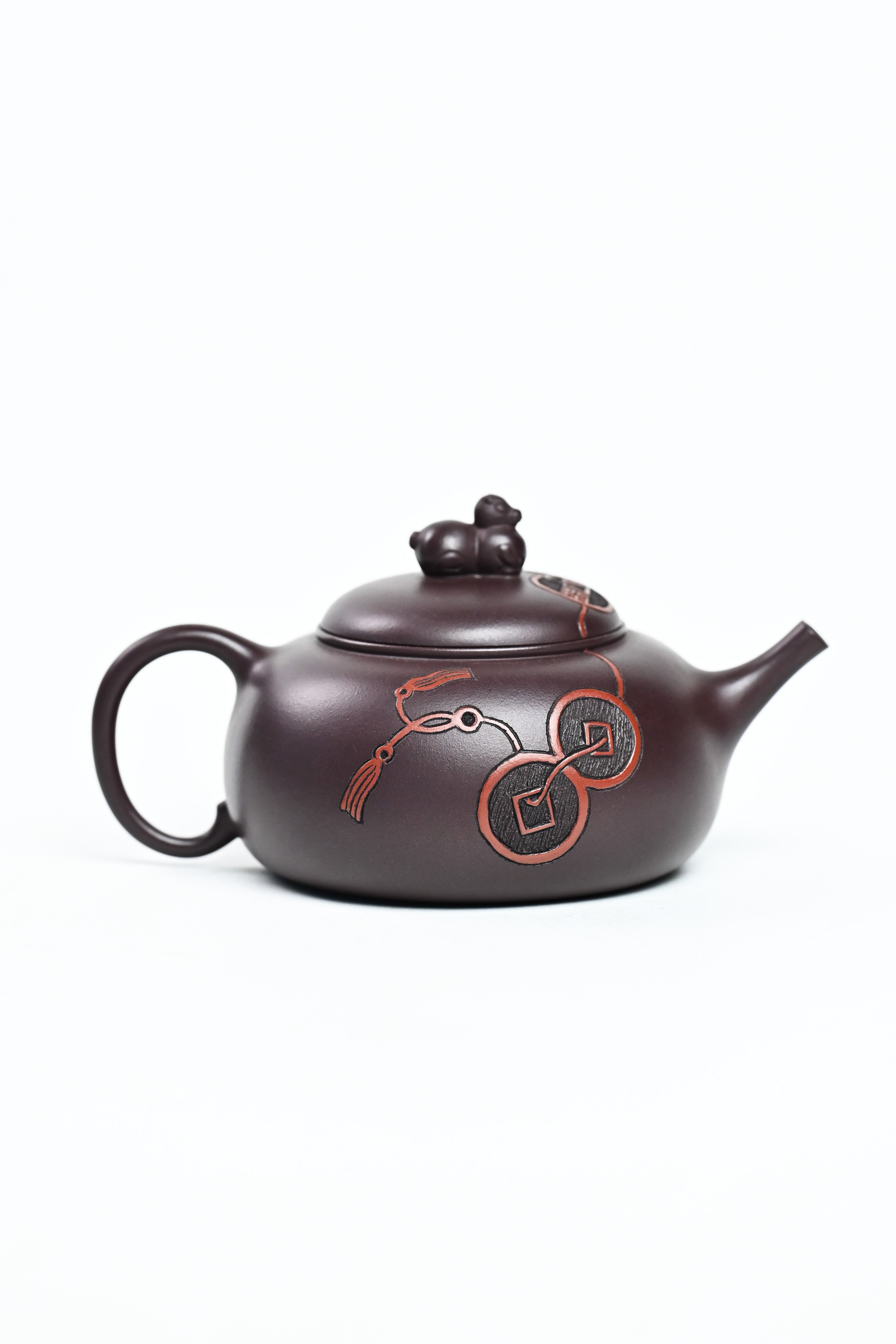 Handmade YANYOO Yixing teapot featuring Zini clay and ancient Chinese Coin sculpture, product right side.