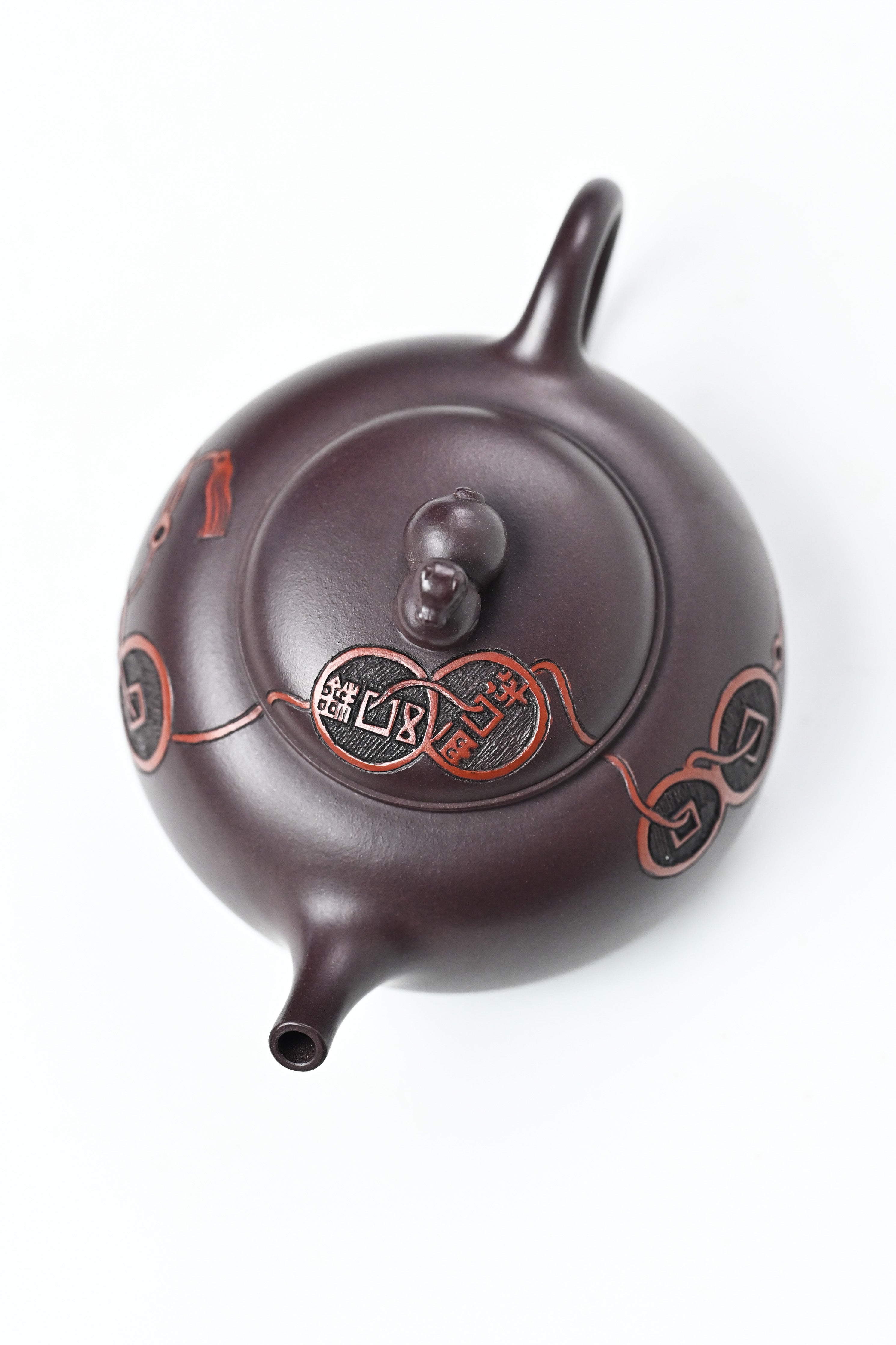 Handmade YANYOO Yixing teapot featuring Zini clay and ancient Chinese Coin sculpture, product top side.