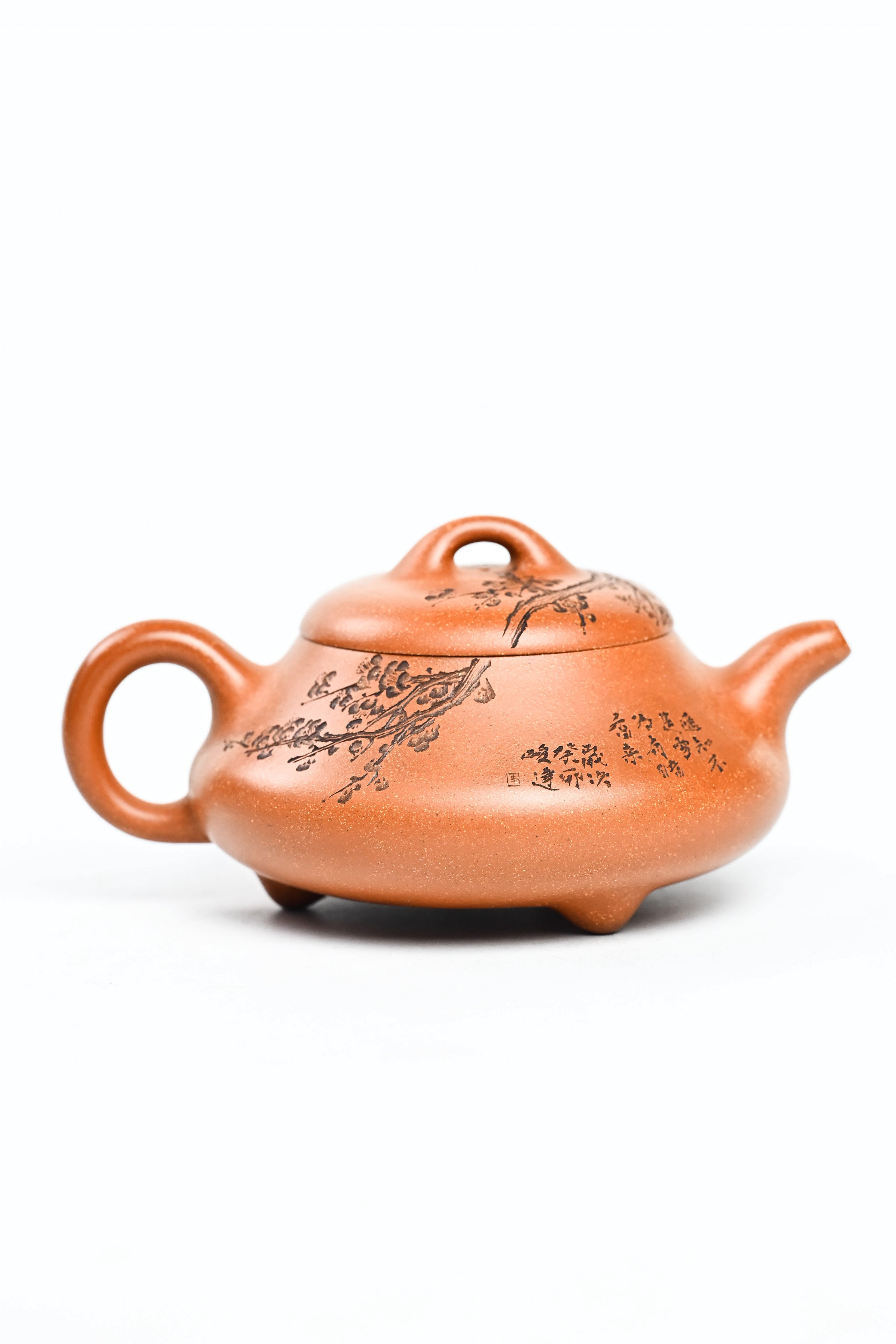 Handmade YANYOO Yixing teapot from Yu Cheng Kiln featuring aged Duanni clay and delicate engraving, product right side.