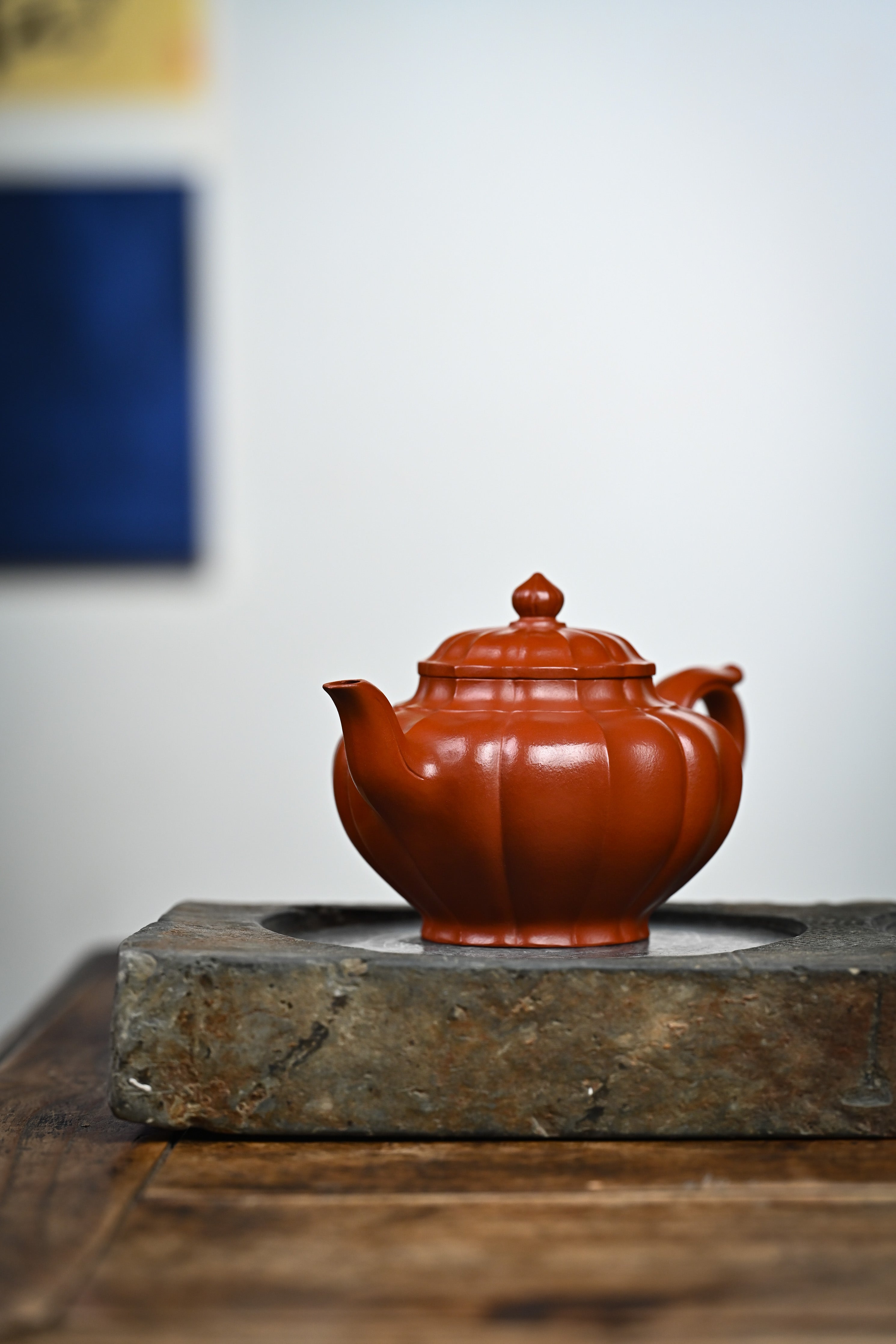 Handmade YANYOO Yixing teapot featuring Zhuni clay and ribbed style, lifestyle front side.