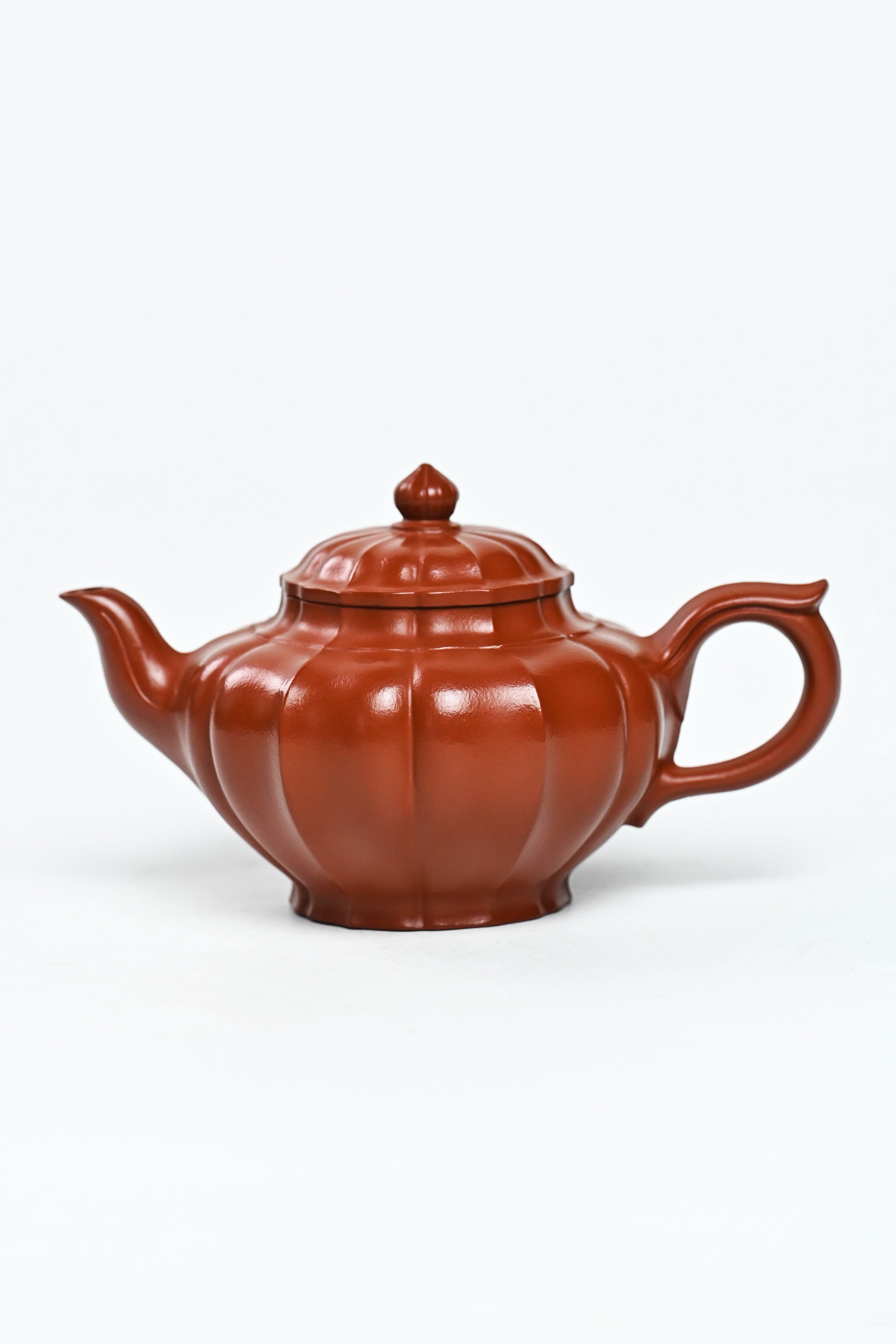 Handmade YANYOO Yixing teapot featuring Zhuni clay and ribbed style, product left side.