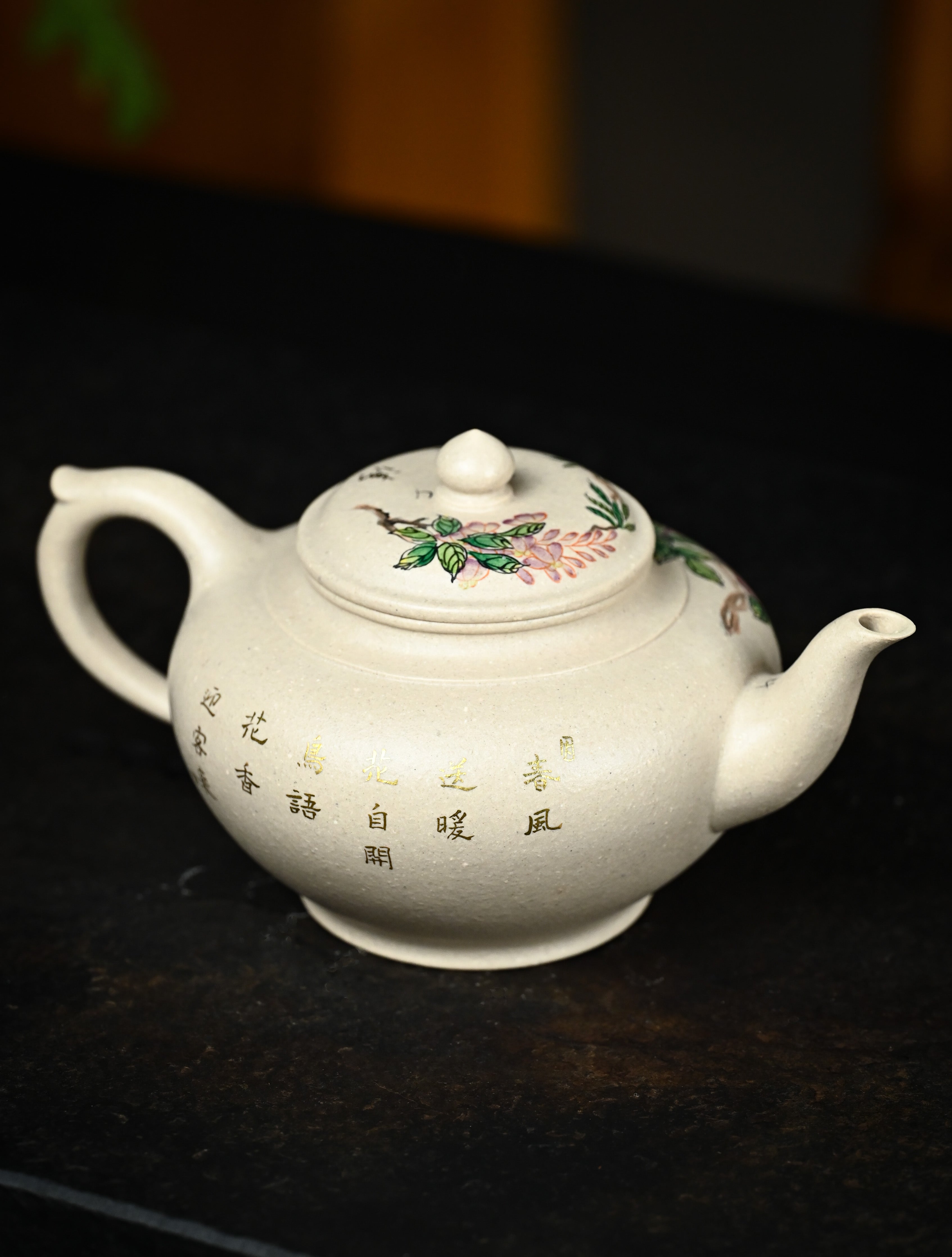 YANYOO handmade Yixing teapot featuring suet white jade Duanni clay and delicate bird-and-peach themed clay painting, Xiao Ying, lifestyle right side.