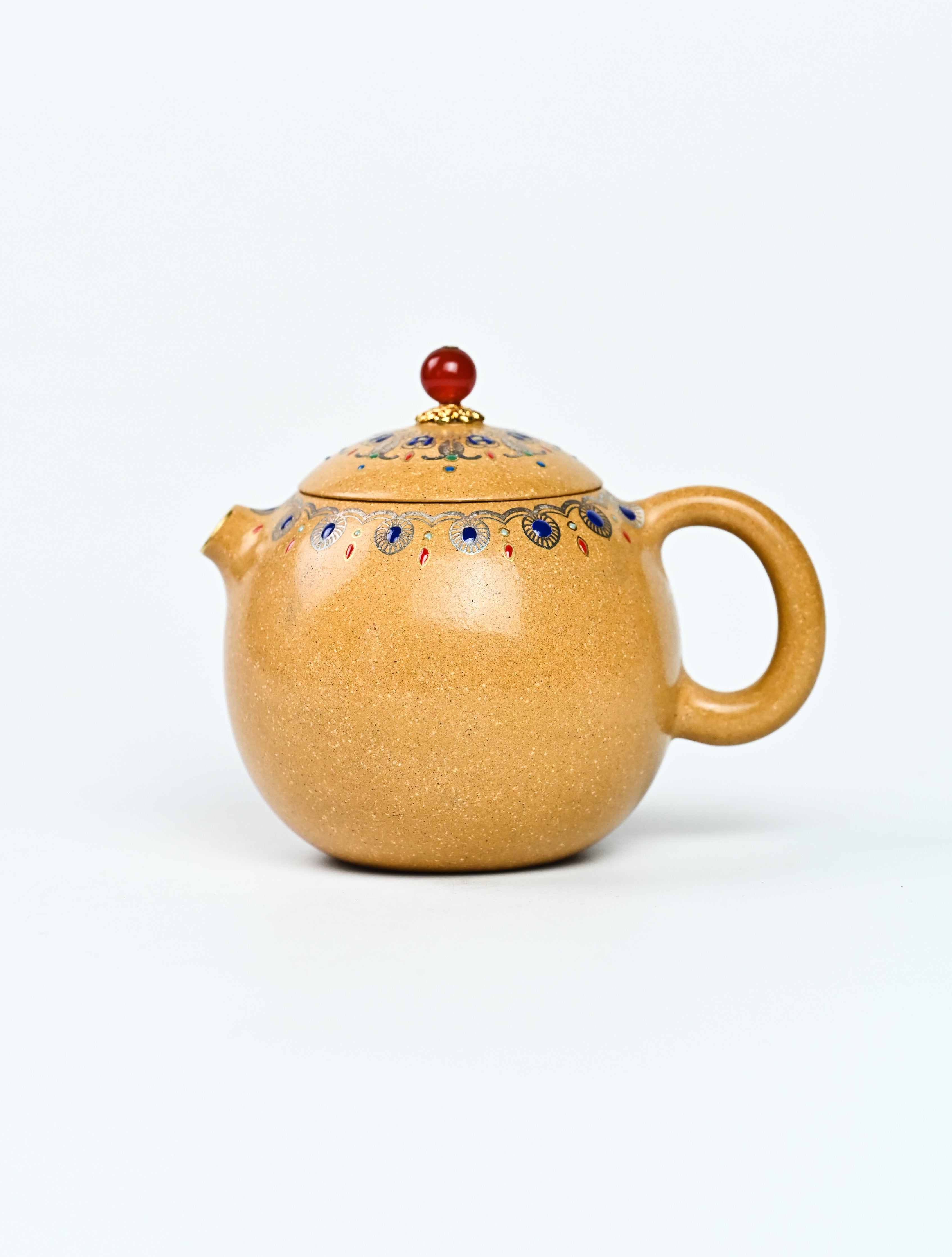 YANYOO handmade Yixing teapot featuring Duanni clay, water polish technique (Shuimo) and delicate Falangcai, Long Dan, product left side.
