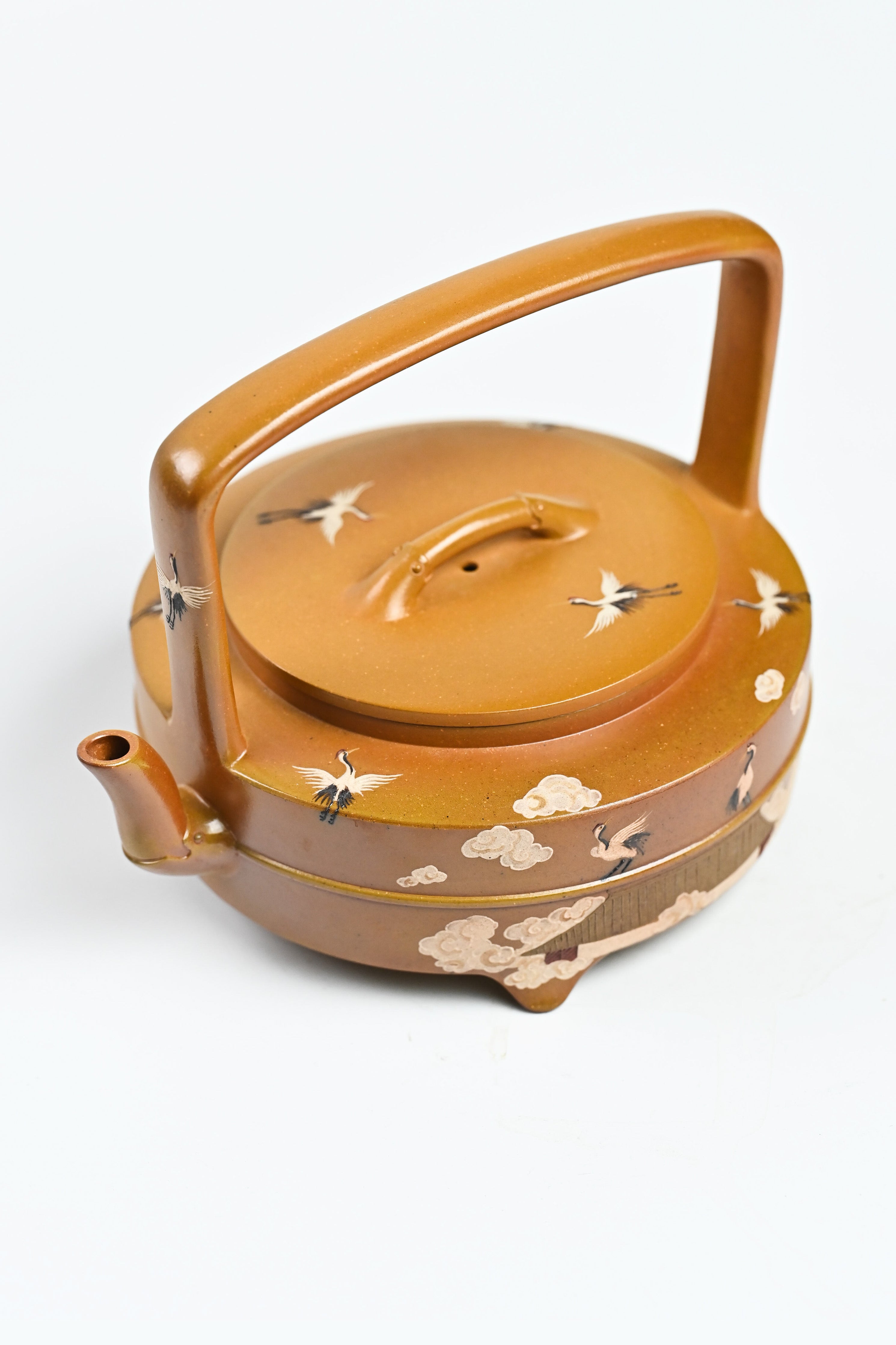 Handmade YANYOO Yixing teapot featuring hand-painted cloud-and-crane motif, product top side.