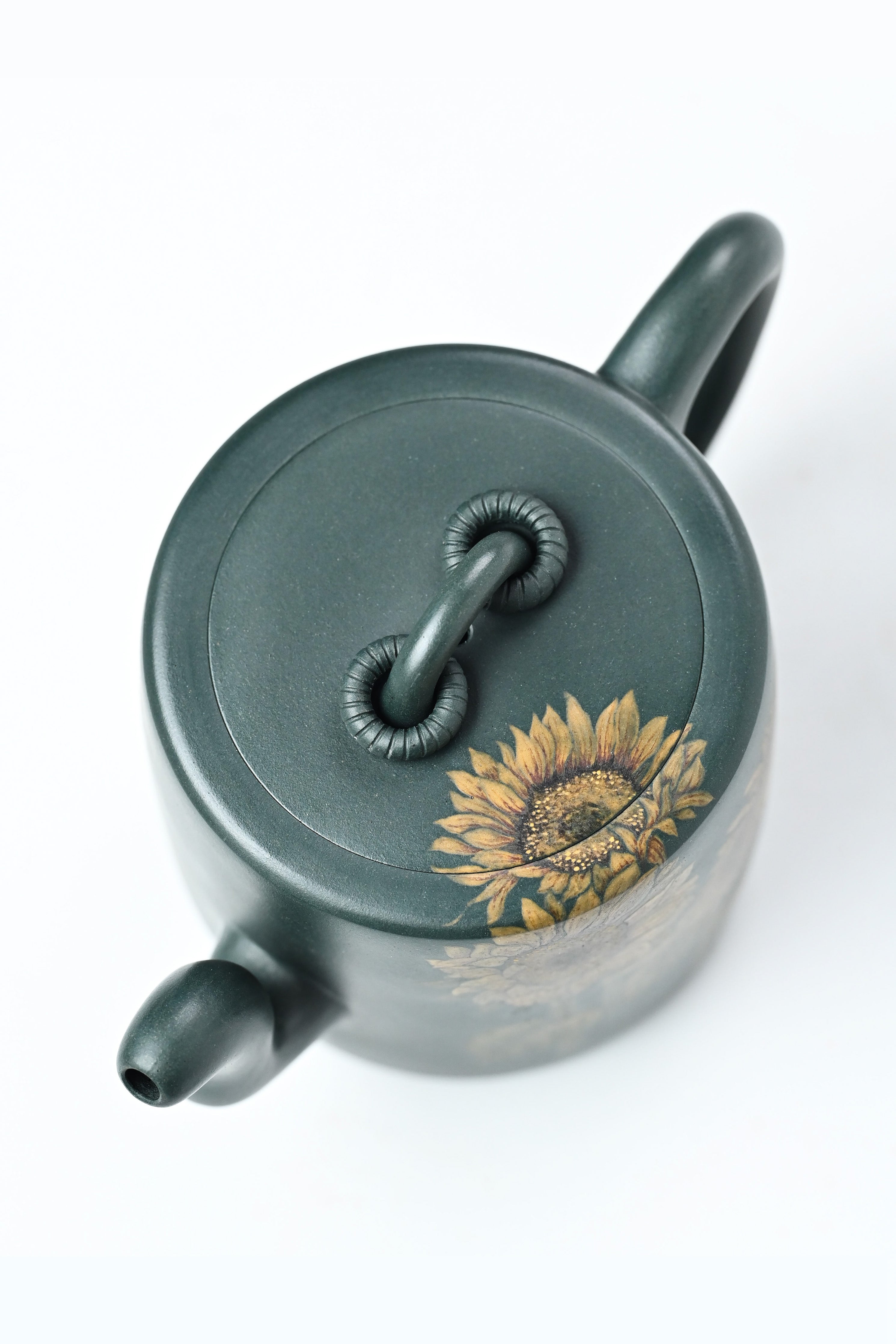 Handmade YANYOO Yixing teapot featuring aged green clay and sunflower design, product top side.