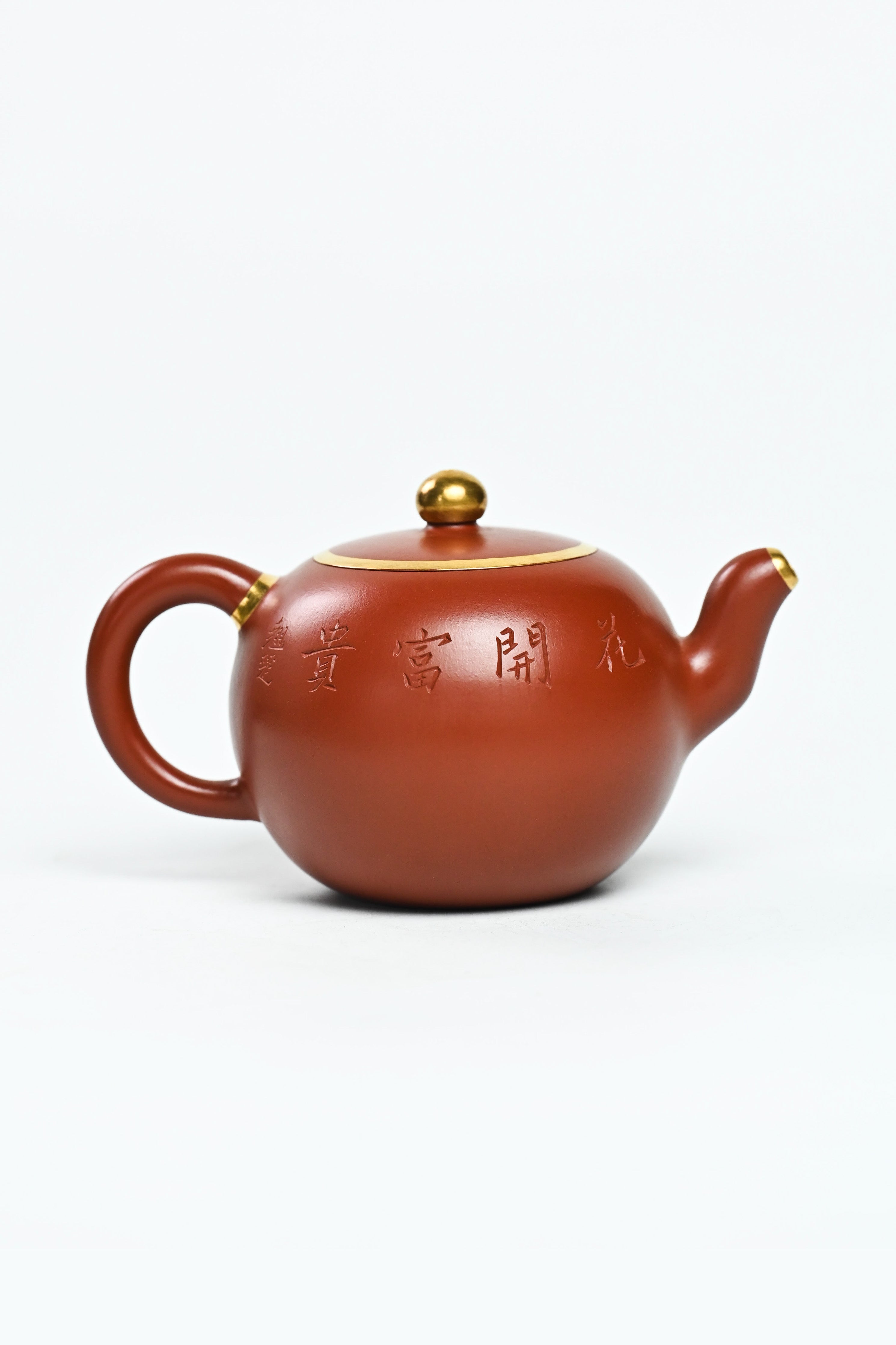 Handmade YANYOO Yixing teapot featuring Zhuni clay and relief engraving, product right side.