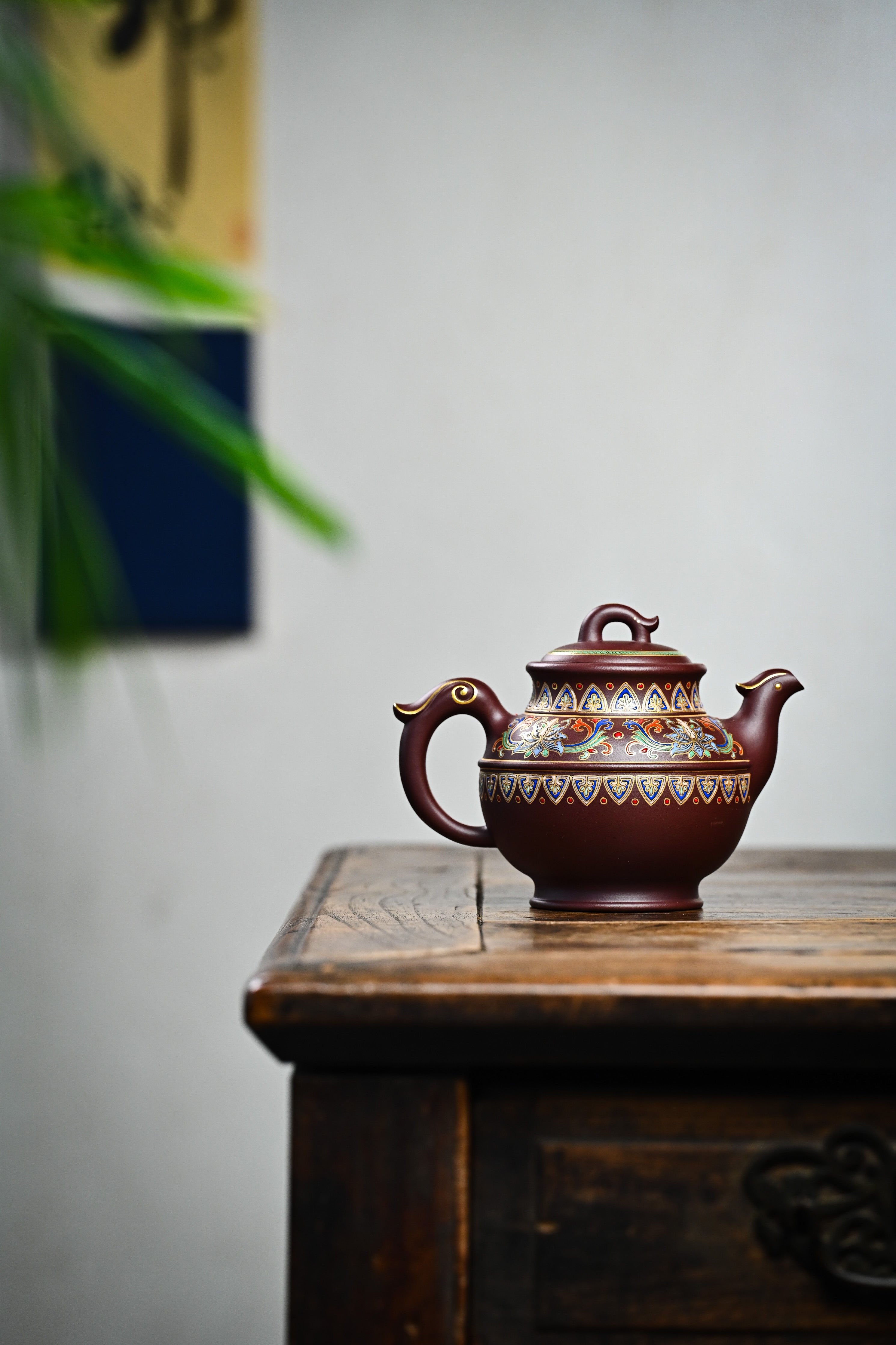 Handmade YANYOO Yixing teapot featuring purple clay and Falangcai lotus-themed design, lifestyle wide-angle right side.