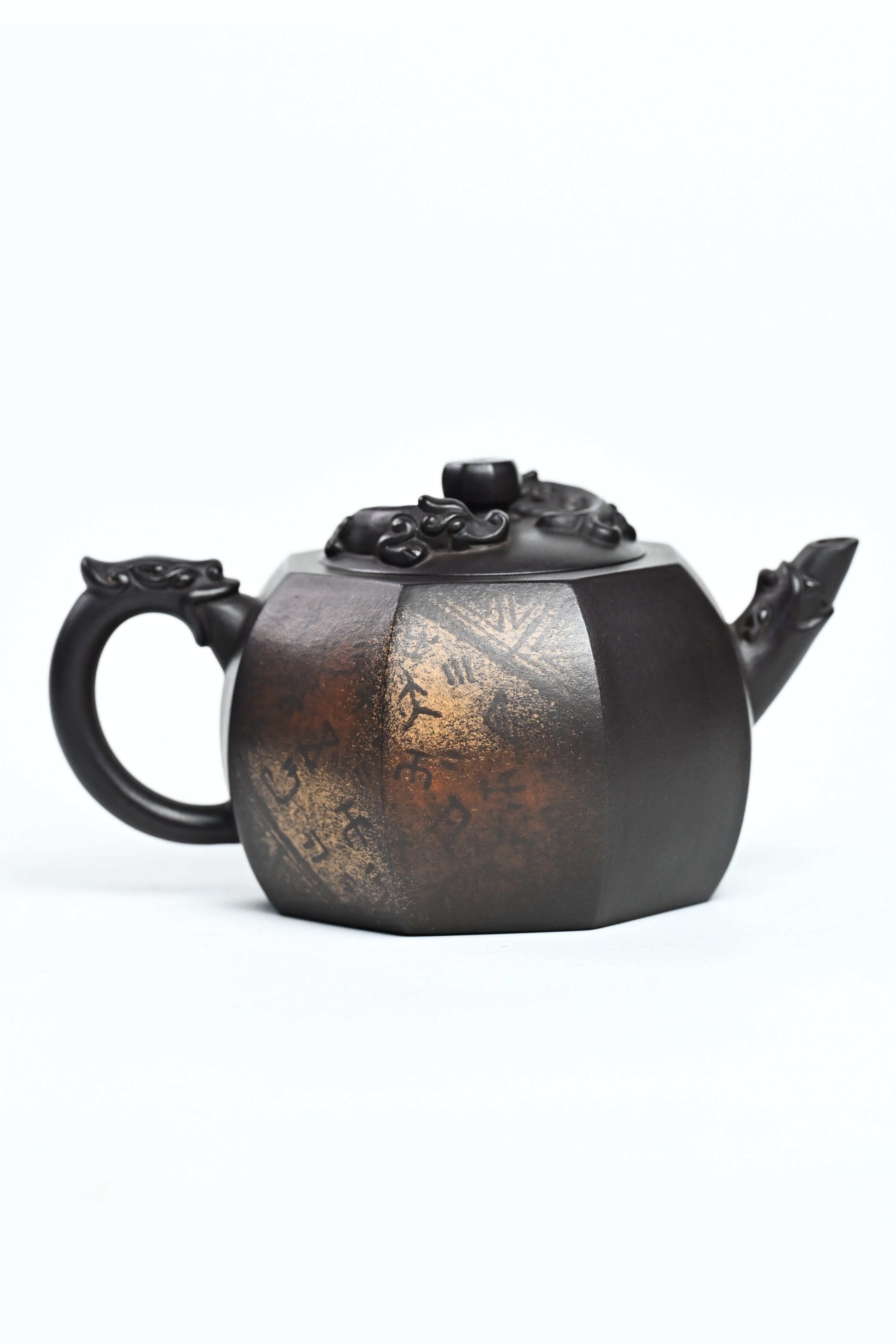 Handmade YANYOO Yixing teapot featuring aged Celadon clay and Oracle Bone scripts pattern, product right side.