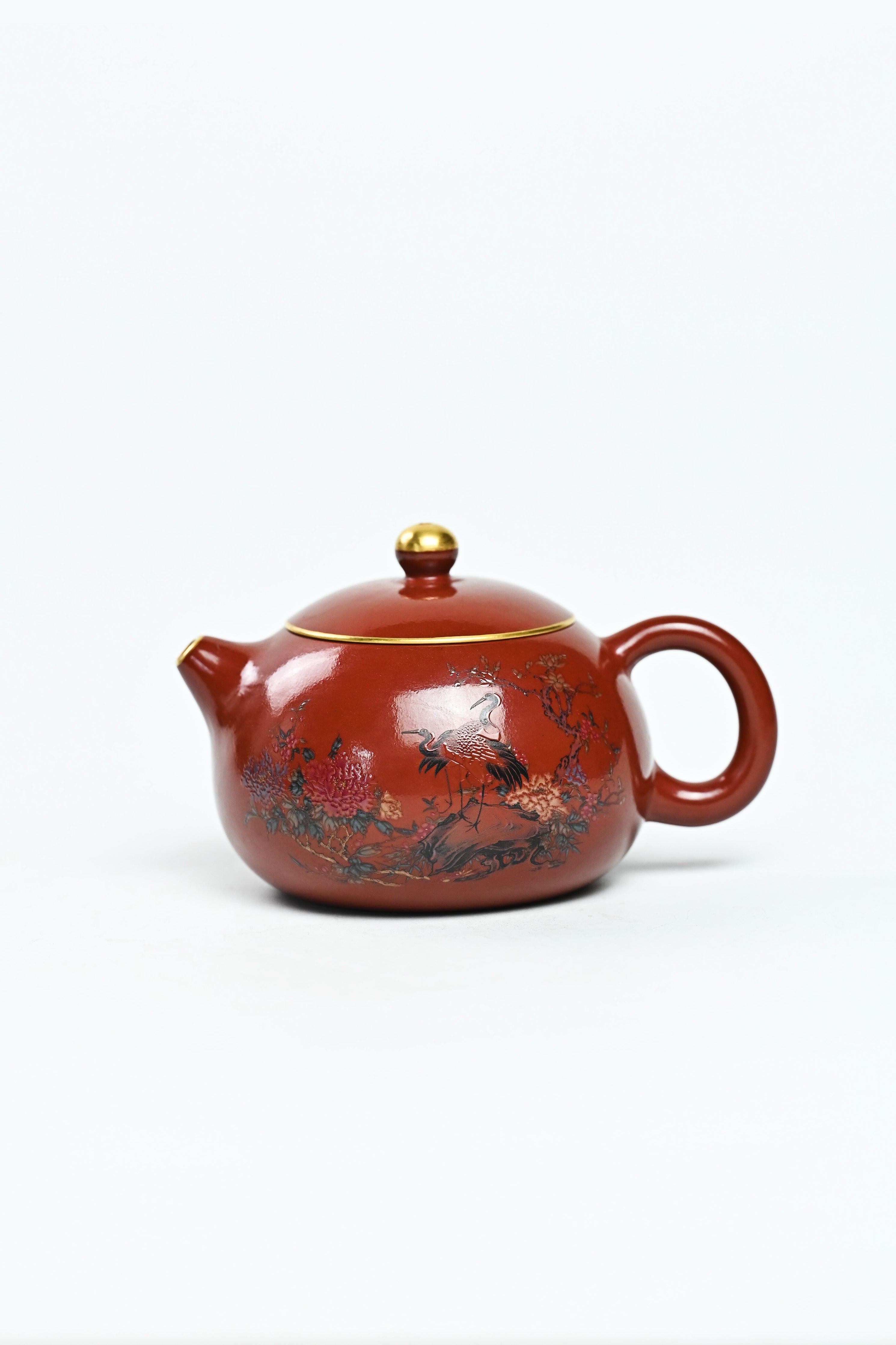 Handmade YANYOO Yixing teapot featuring Zhuni clay, hand-painted pattern and water-polished craftsmanship, product left side.