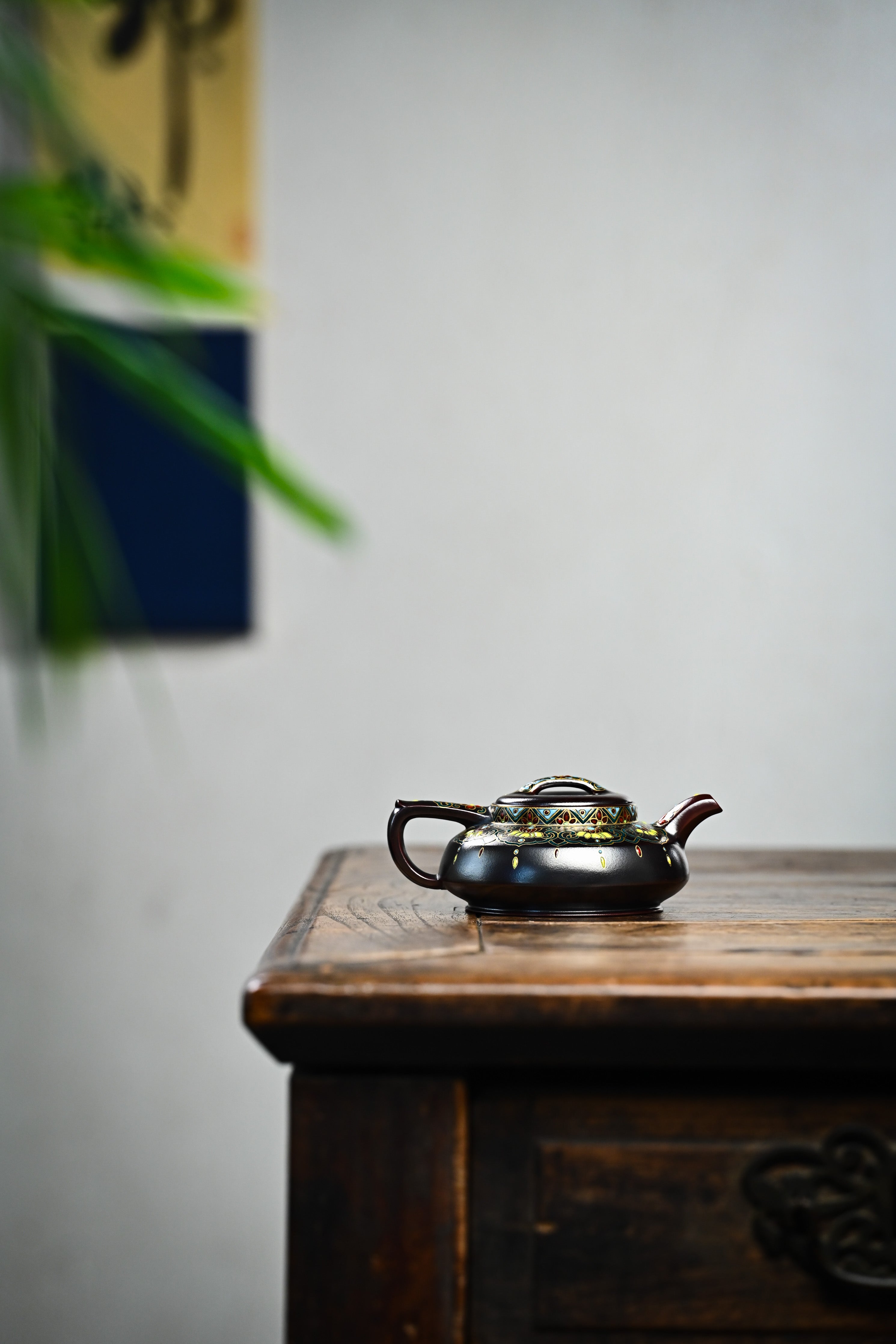 Handmade YANYOO Yixing teapot featuring Falangcai Ru Yi pattern, lifestyle wide-angle right side.