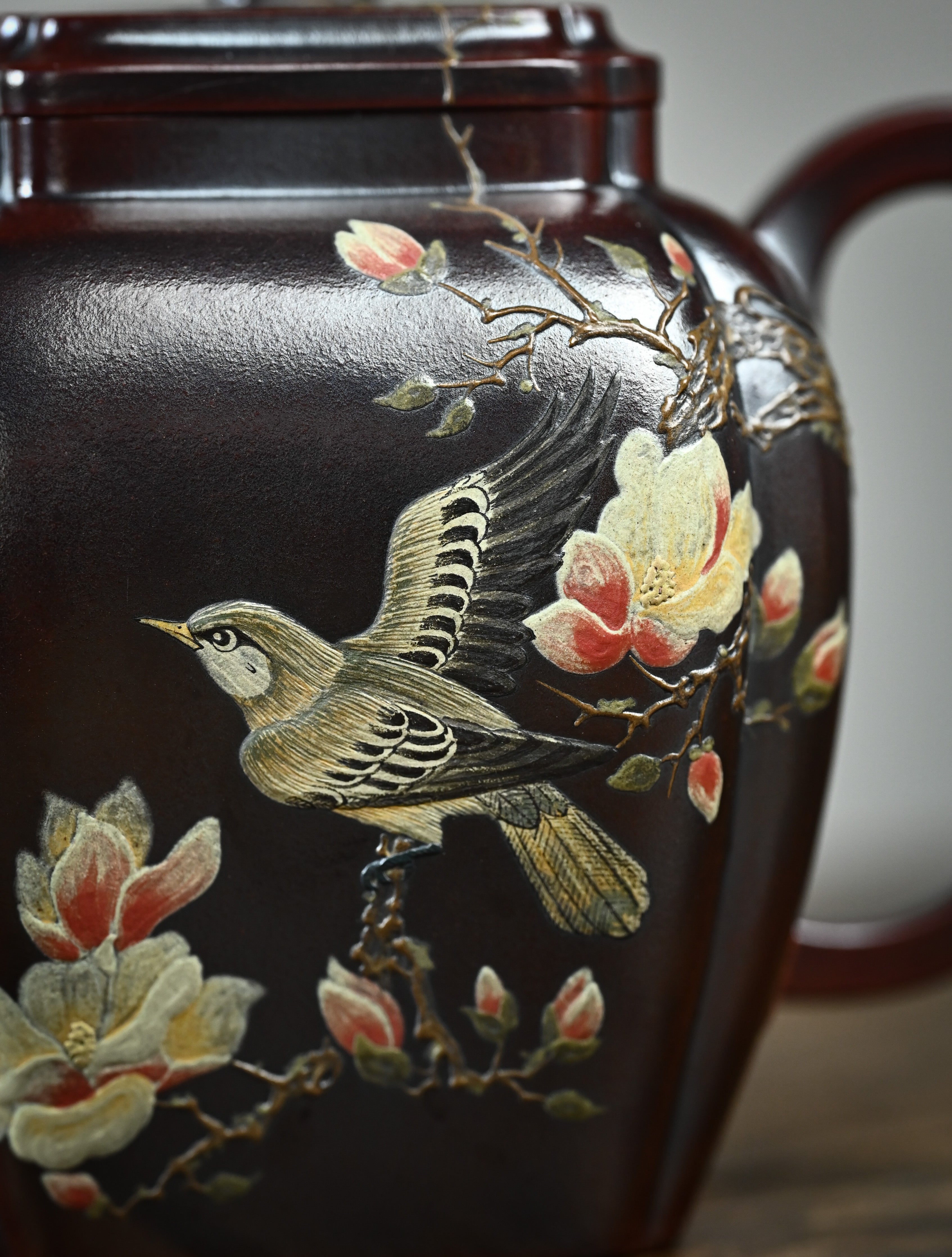 YANYOO handmade Yixing teapot featuring aged Wuni clay, bird-and-flower painting and a unique square shape, Ru Fang, lifestyle detail front side.