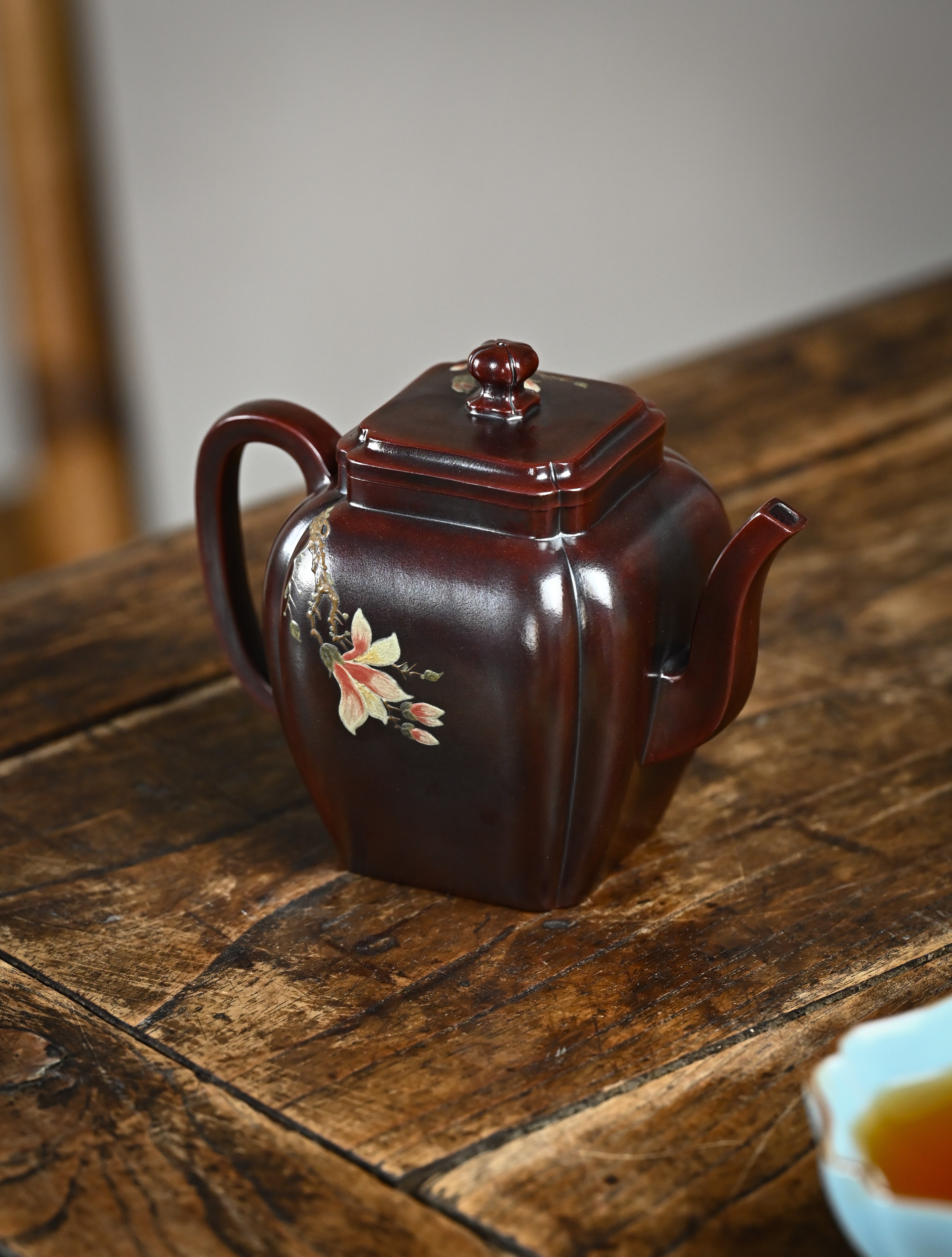 YANYOO handmade Yixing teapot featuring aged Wuni clay, bird-and-flower painting and a unique square shape, Ru Fang, lifestyle right side.