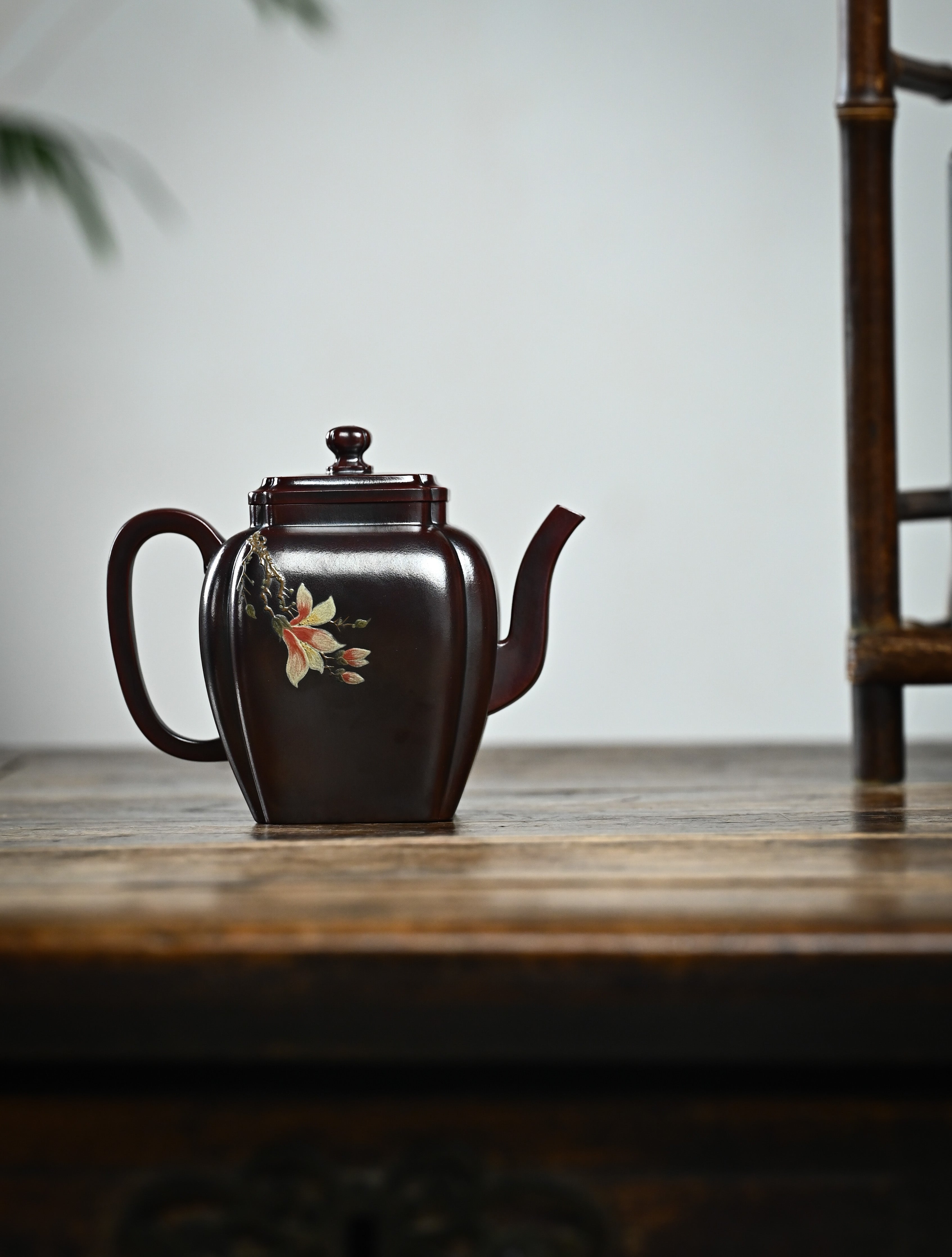 YANYOO handmade Yixing teapot featuring aged Wuni clay, bird-and-flower painting and a unique square shape, Ru Fang, lifestyle wide-angle right side.