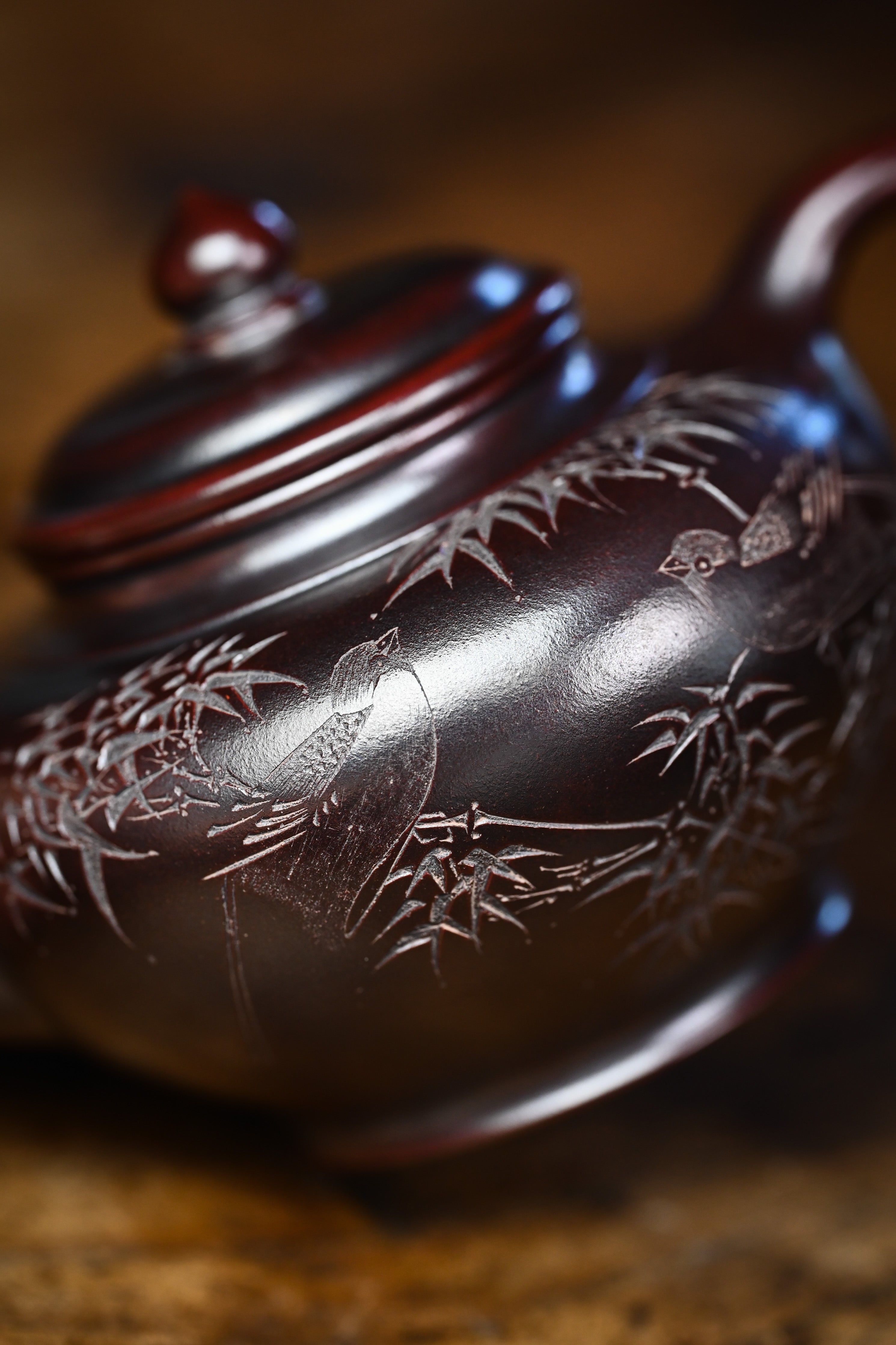 Handmade YANYOO Yixing teapot featuring aged Wuni clay and engraving, Xiao Ying, lifestyle detail left side.