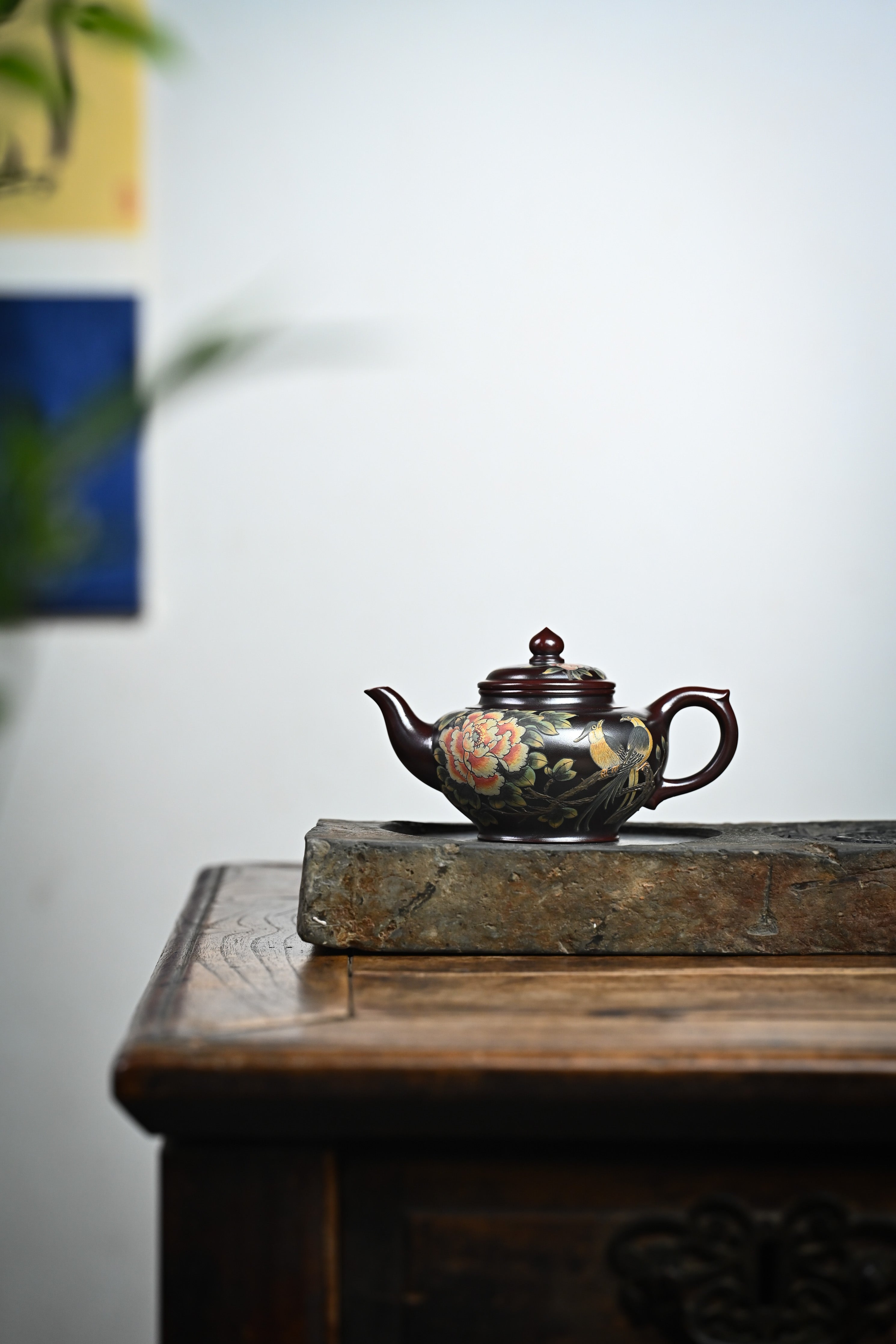 Handmade YANYOO Yixing teapot featuring aged Wuni clay and painting, Xiao Ying, lifestyle wide-angle left side.