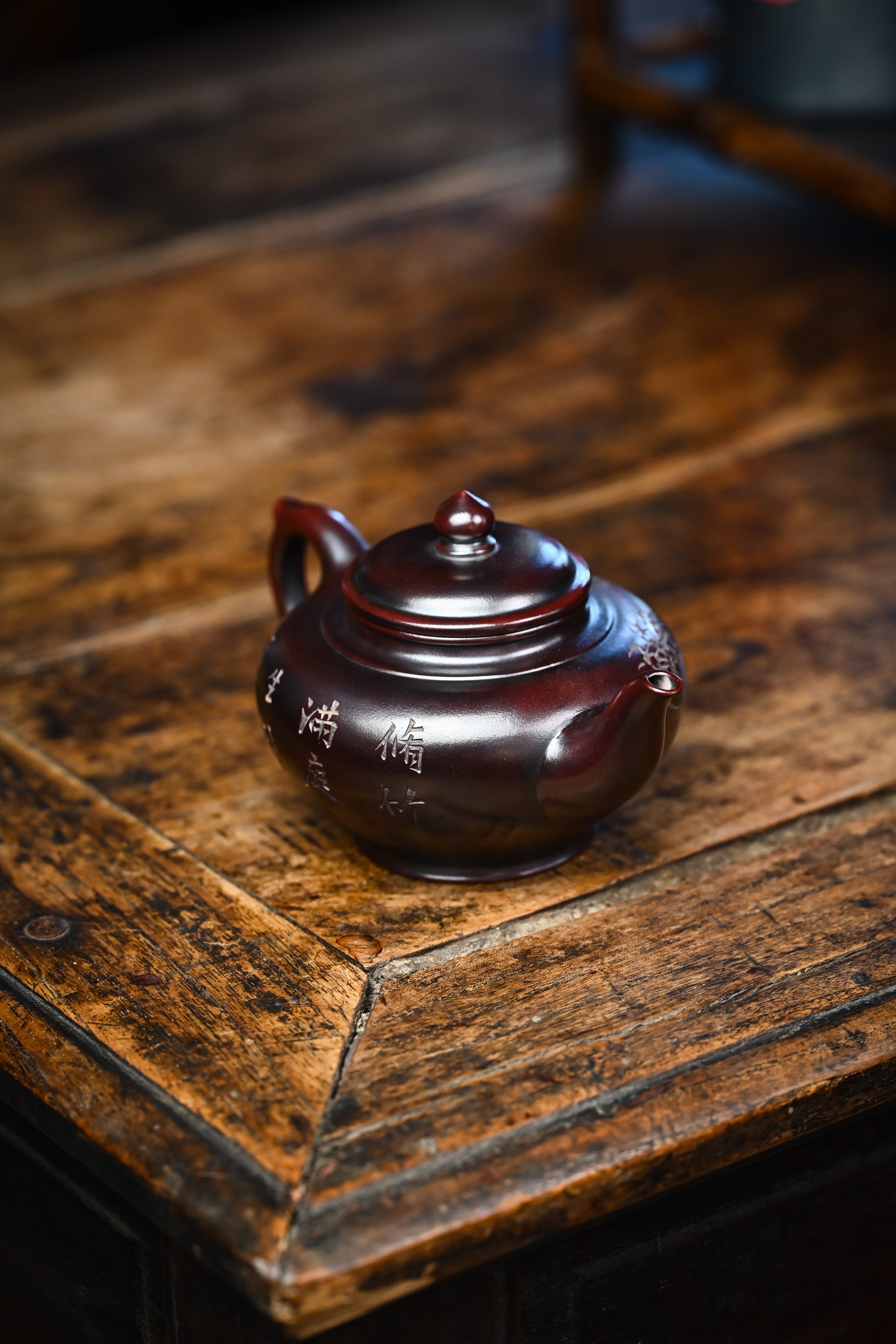 Handmade YANYOO Yixing teapot featuring aged Wuni clay and engraving, Xiao Ying, lifestyle right side.