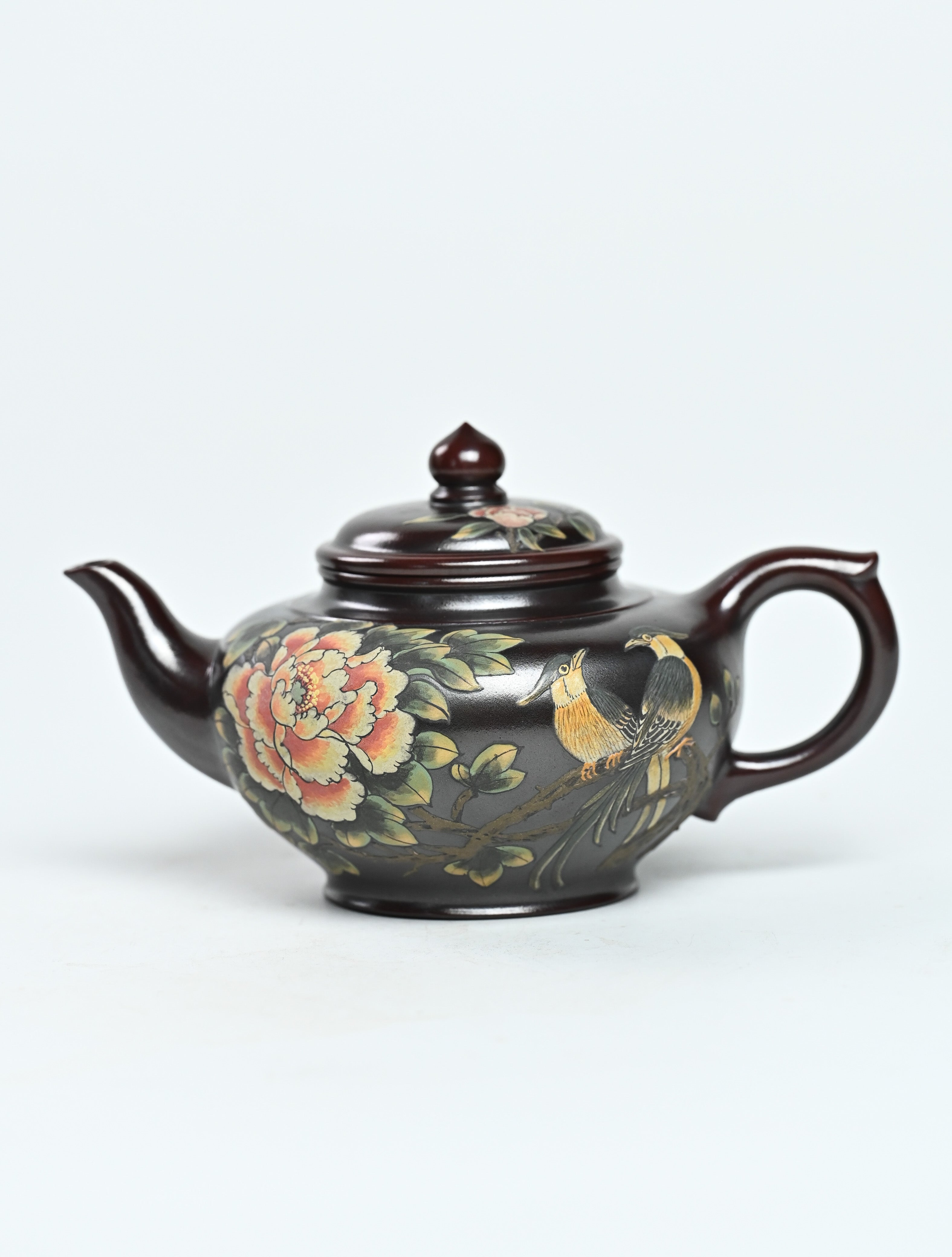 YANYOO handmade Yixing teapot featuring aged Wuni clay and bird-and-flower painting, product left side.