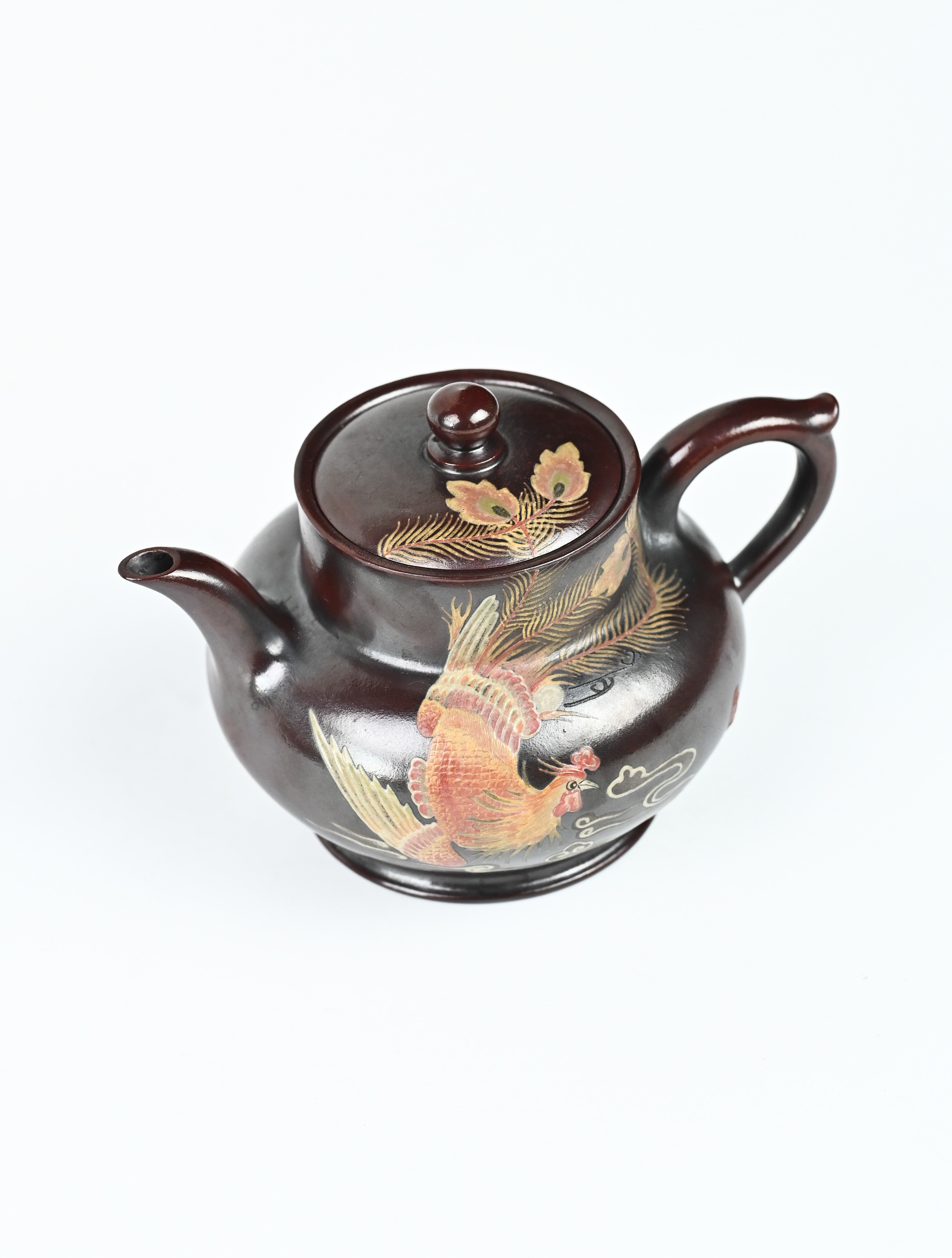 YANYOO handmade Yixing teapot featuring aged Wuni clay and phoenix-and-cloud painting, product top side.