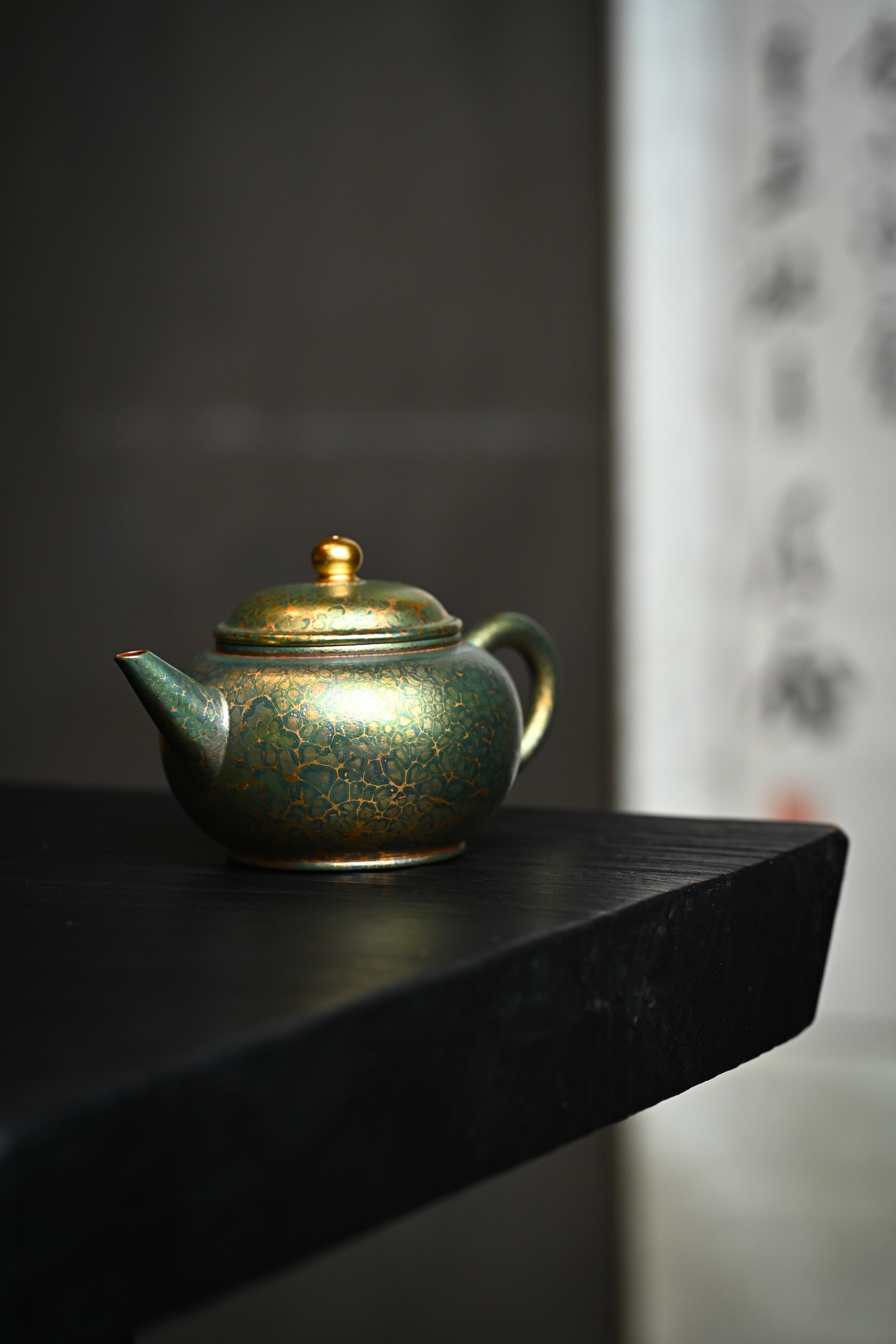 Handmade YANYOO Yixing teapot featuring Feather-Plume firing technique, Shui Ping Matcha, lifestyle front side.