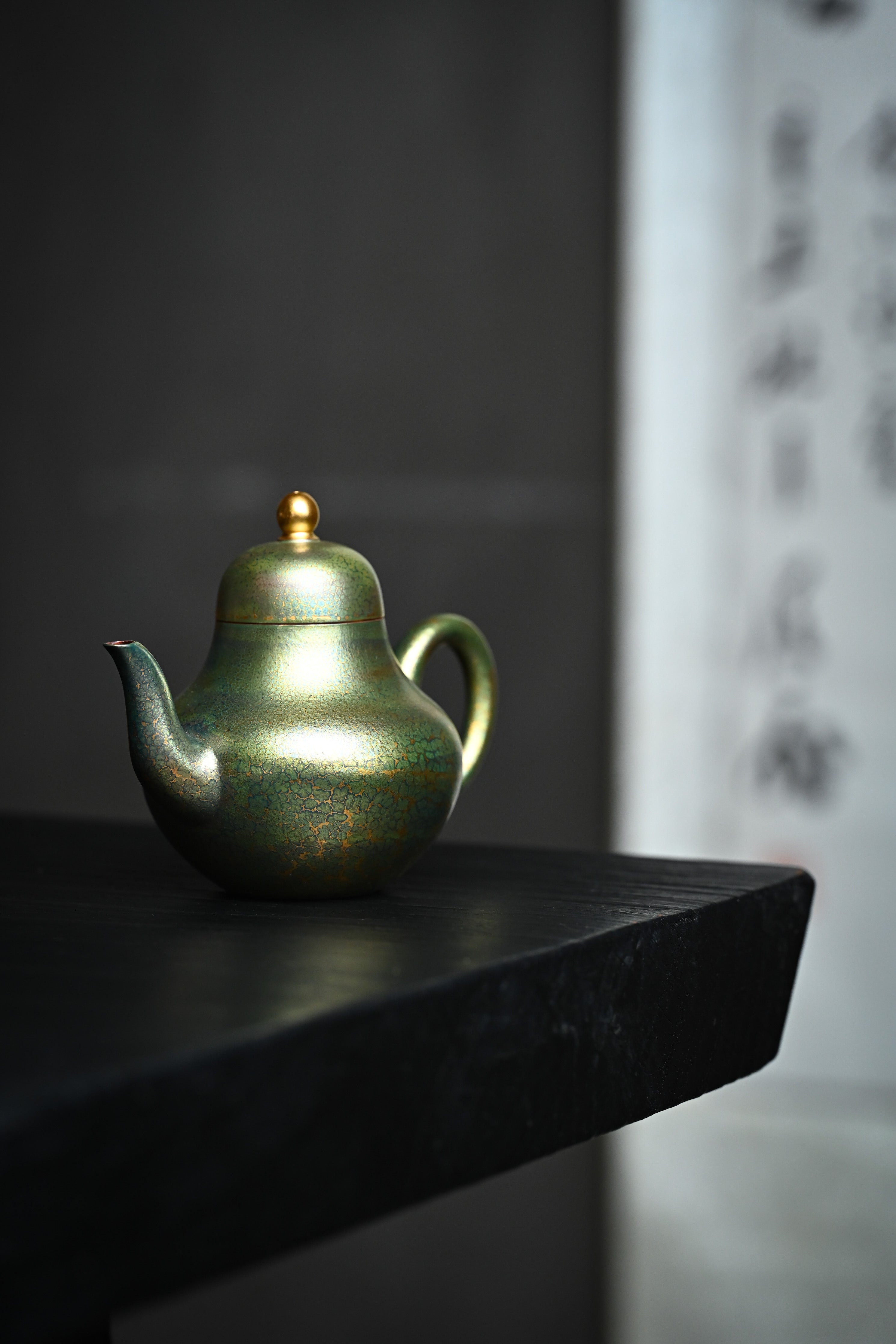 Handmade YANYOO Yixing teapot featuring Feather-Plume firing technique, Si Ting Matcha, lifestyle front side.