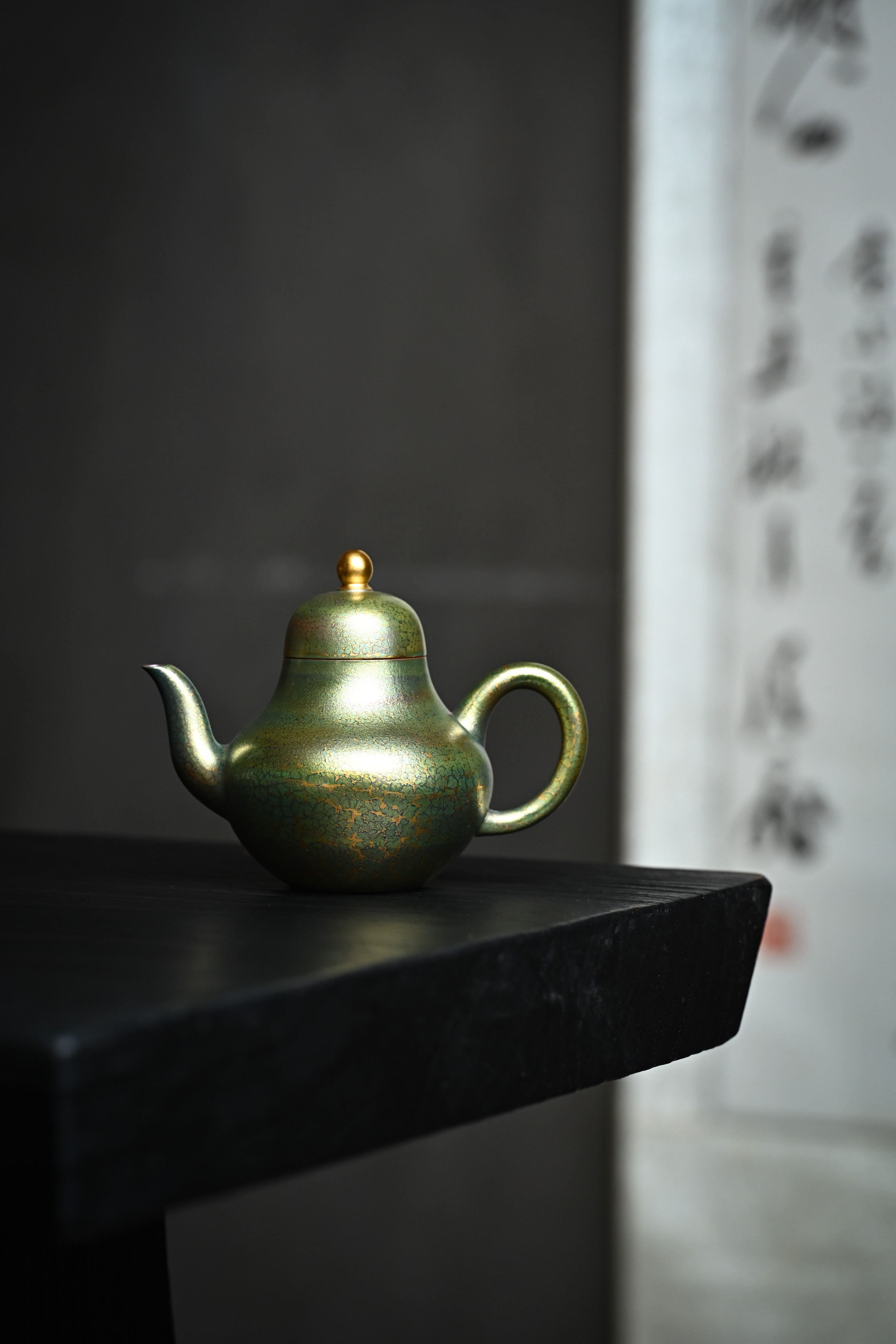 Handmade YANYOO Yixing teapot featuring Feather-Plume firing technique, Si Ting Matcha, lifestyle wide-angle left side.