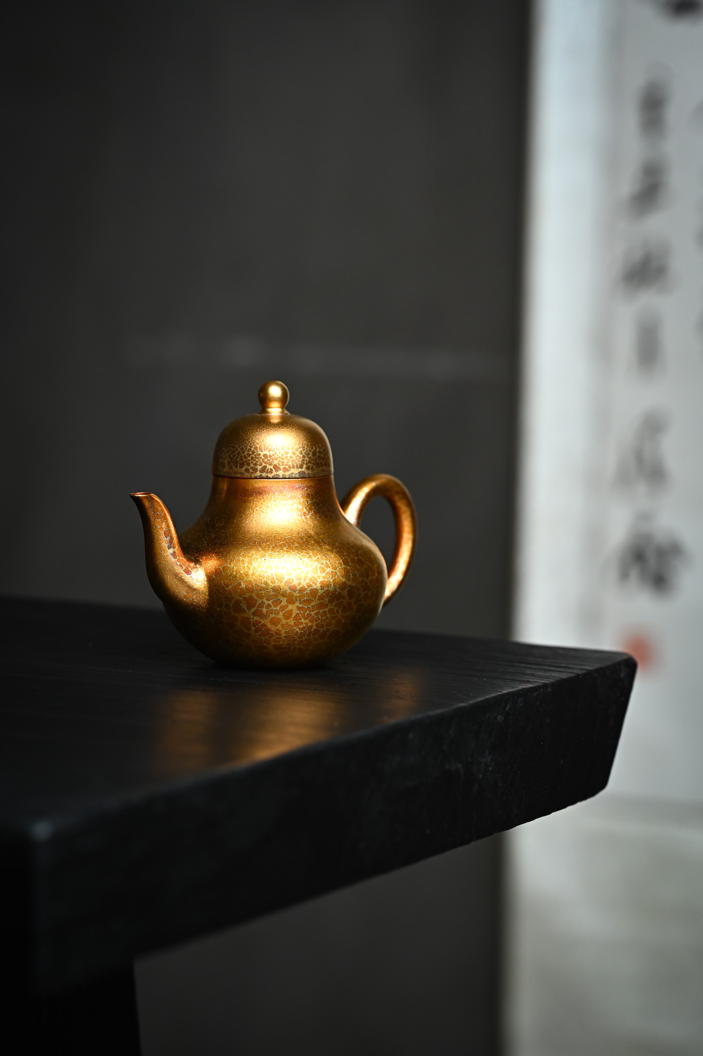 Handmade YANYOO Yixing teapot featuring Feather-Plume firing technique, Si Ting, lifestyle front side.